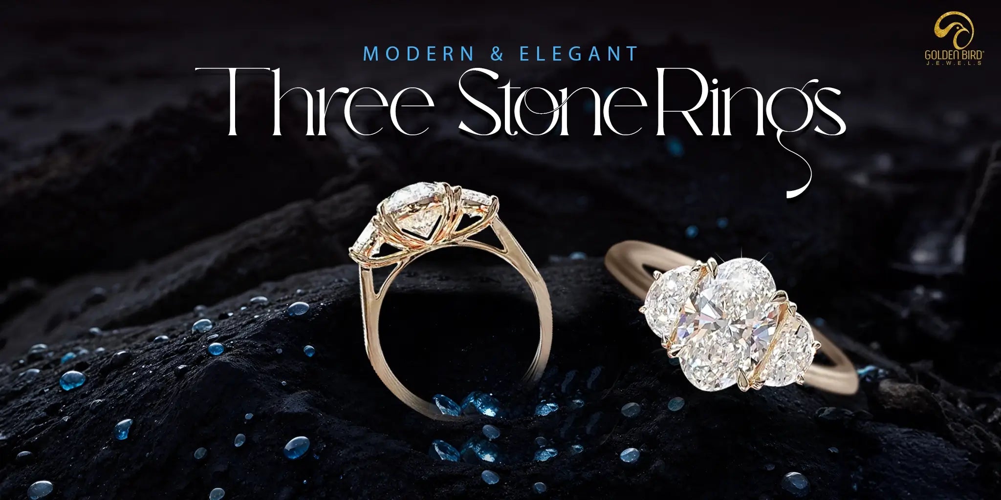 Three-stone engagement ring made by goldenbird jewels placed on black surface with glittering blue dew drops and text written"Elegamt and Modern- Three-stone engagement ring