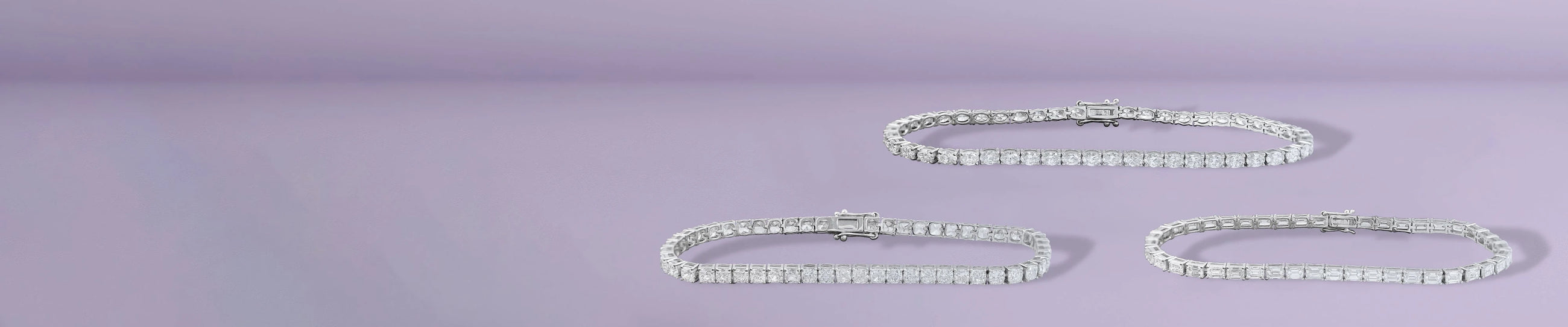 Lab grown diamond bracelets in tennis and bangle styles on purple background