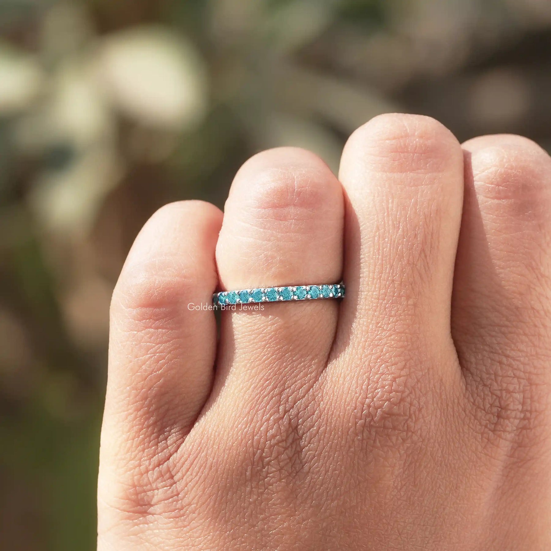 Close view of Blue Round Cut Moissanite Solitaire Ring