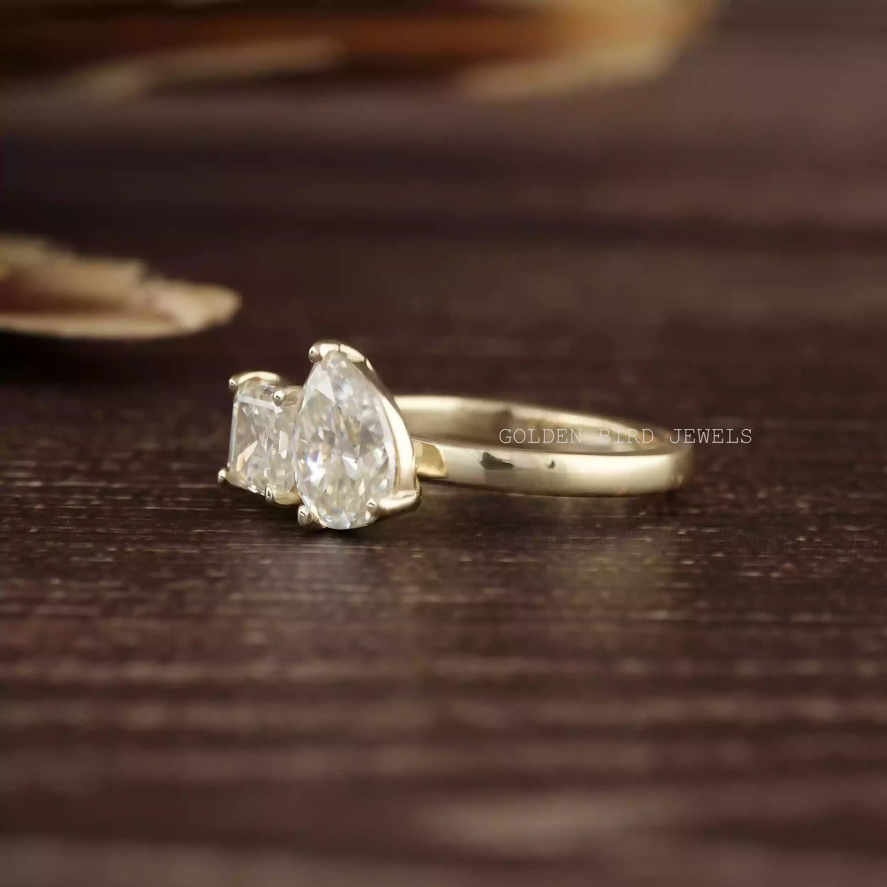 Detailed view of toi et moi moissanite ring crafted with prongs setting