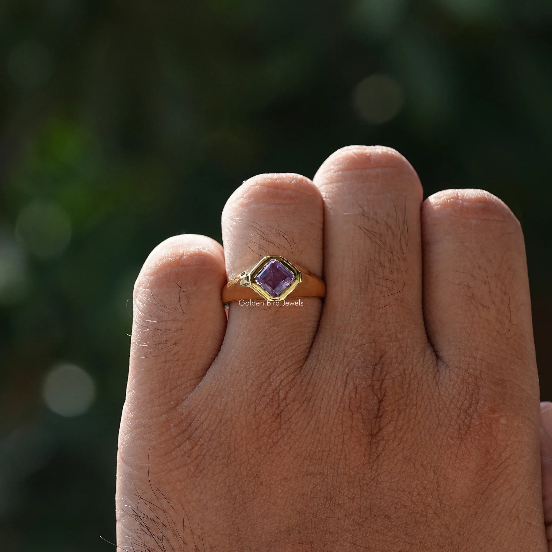 Close view of moissanite ring in secure setting