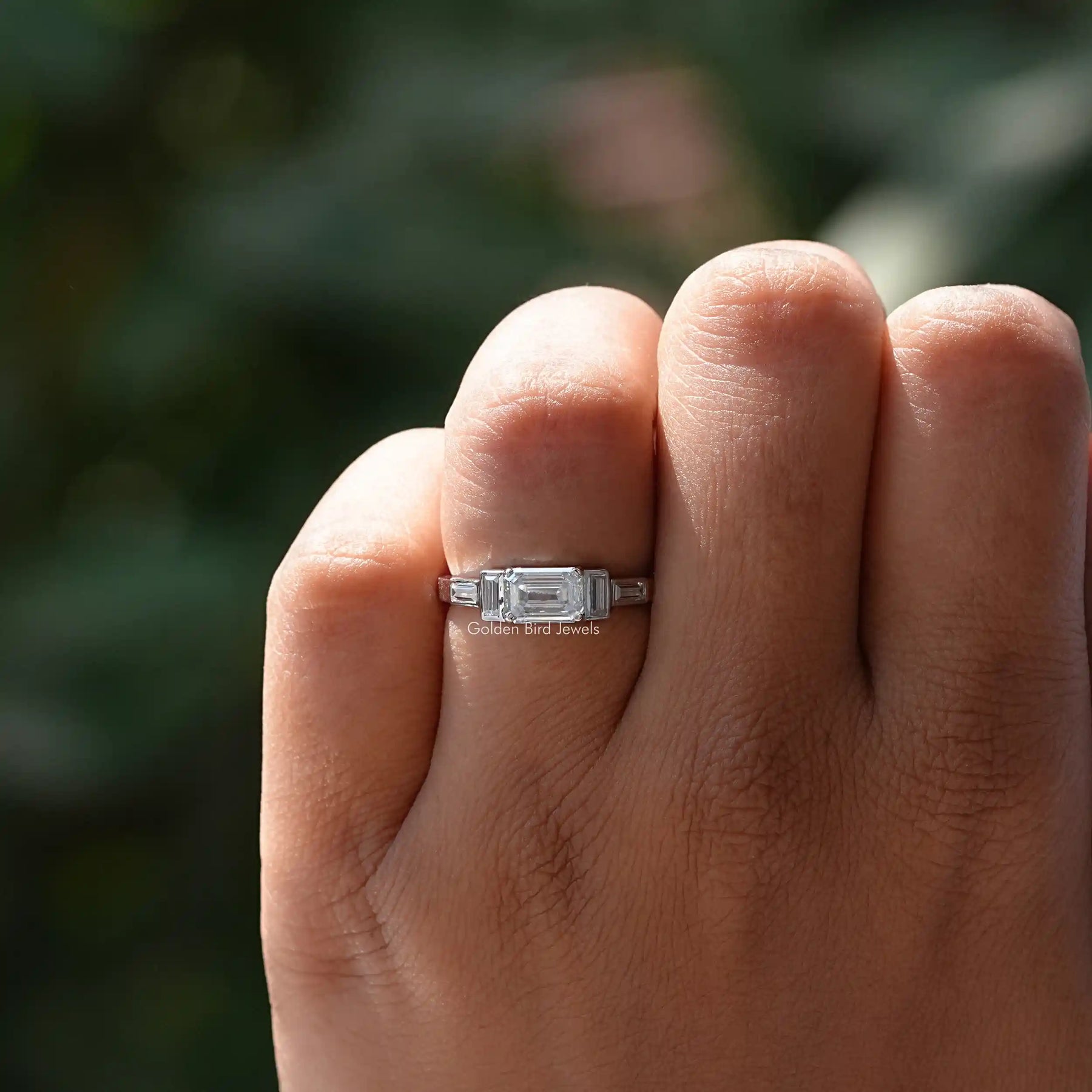 View of Emerald And Baguette Cut Moissanite Ring In finger