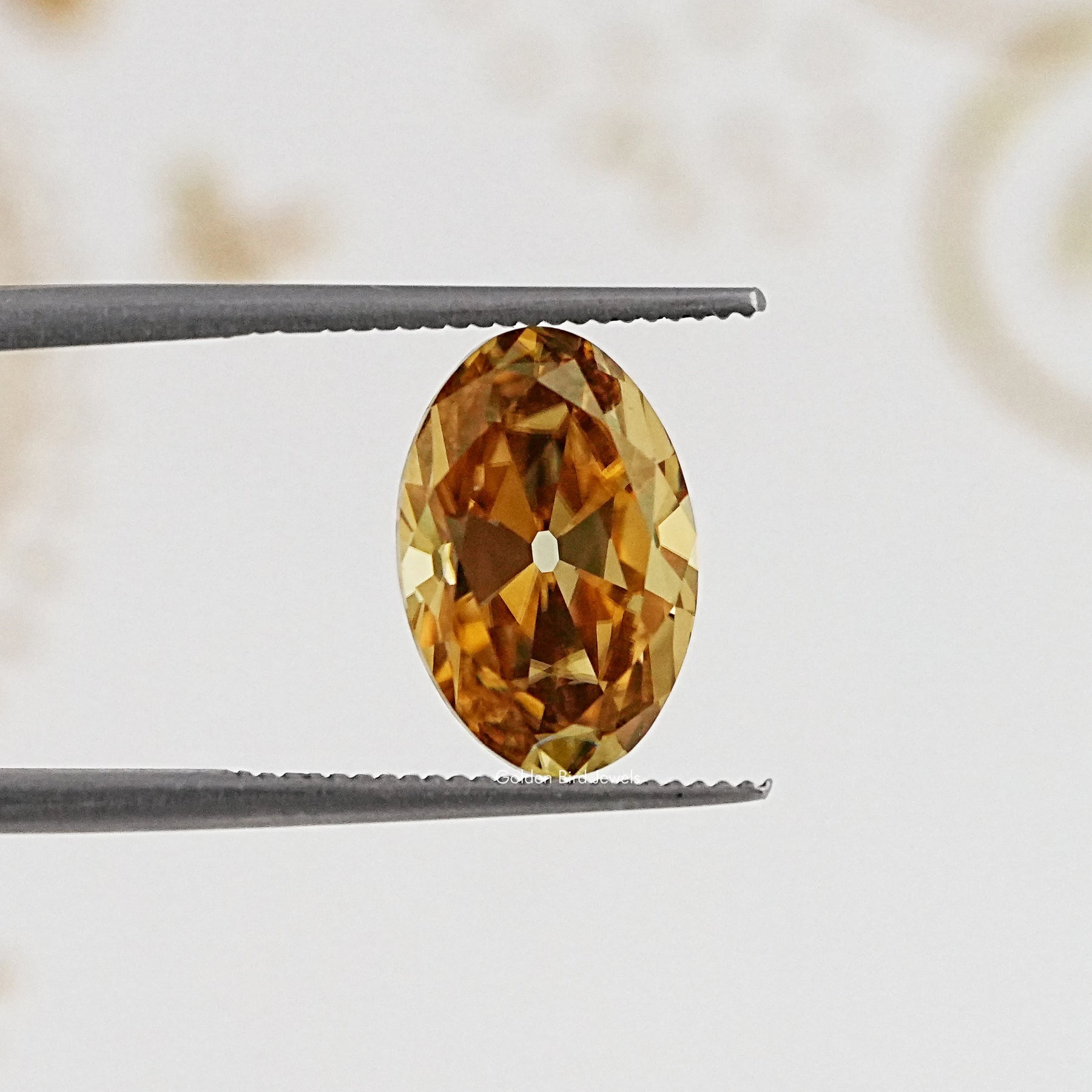 In Tweezer View Of Old Mine Oval Cut Loose Moissanite Stone