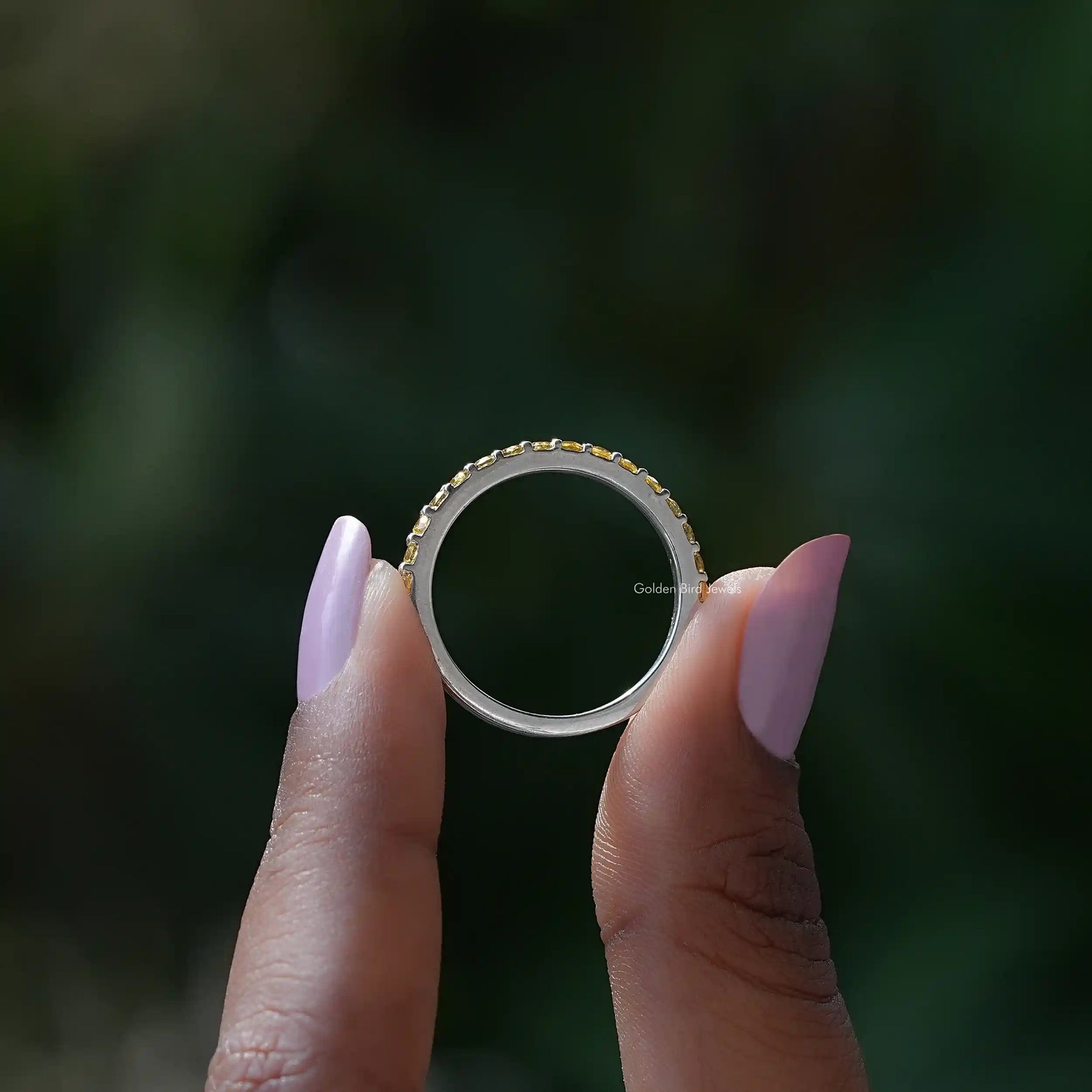 Back view of Citrine Yellow Round Eternity Band in secure setting