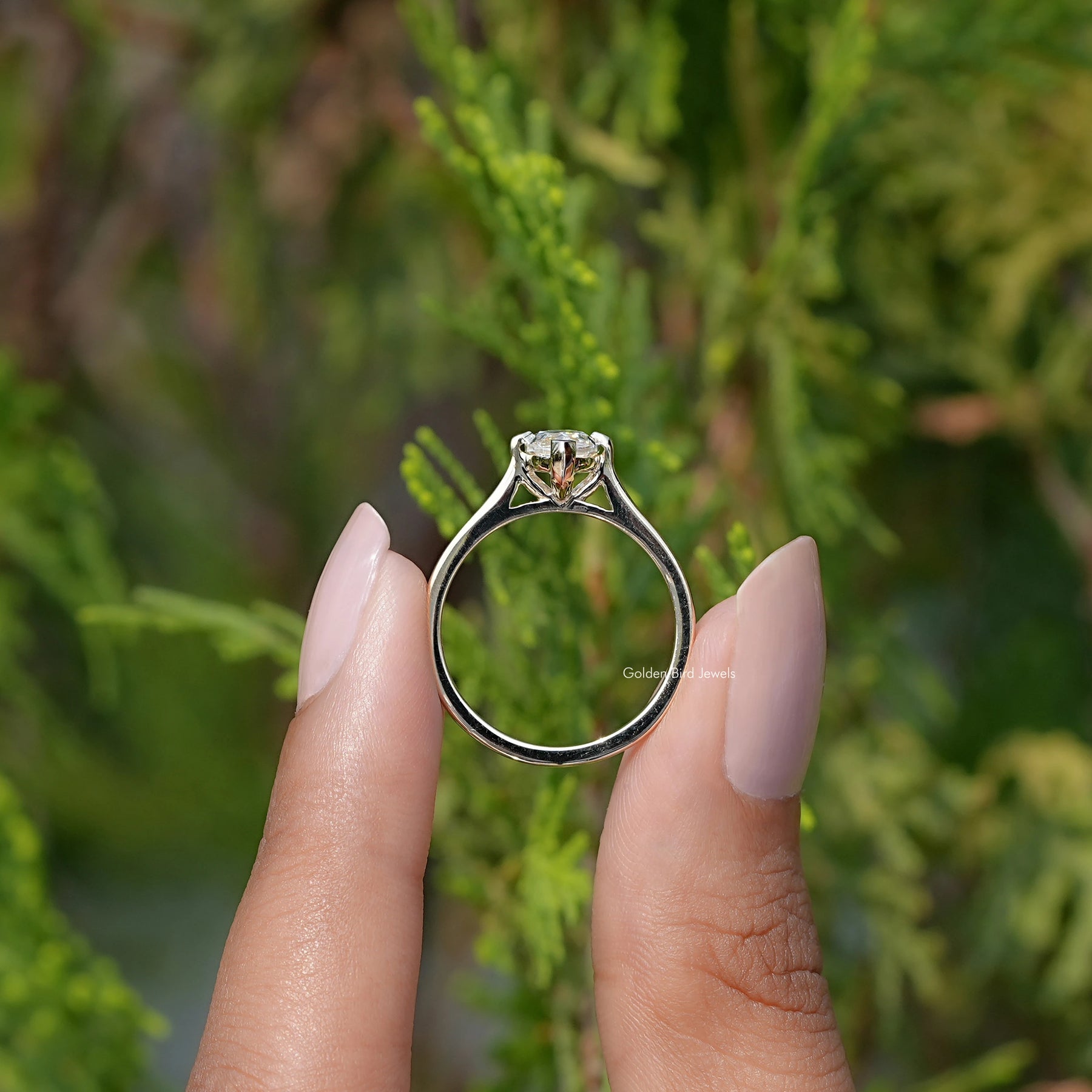 Marquise Cut Moissanite Solitaire Ring in two fingers