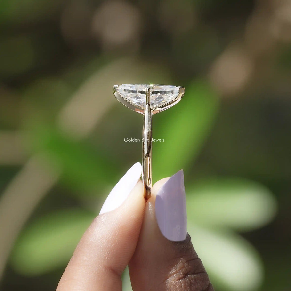 Side view of Dutch Marquise Yellow Gold Moissanite Ring on two fingers