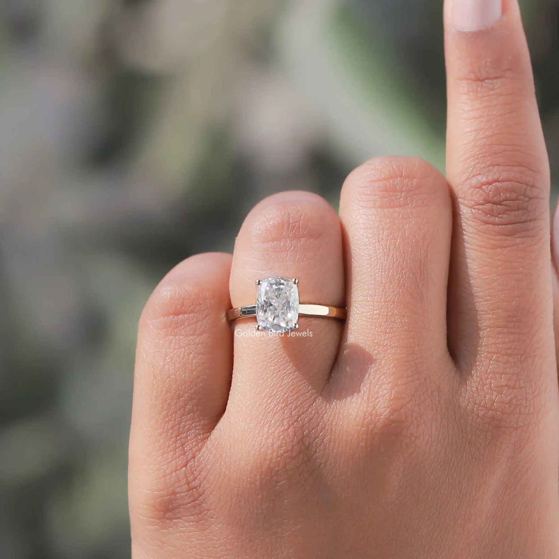 Close-Up View of Moissanite Cushion Cut Solitaire Ring In Yellow Gold