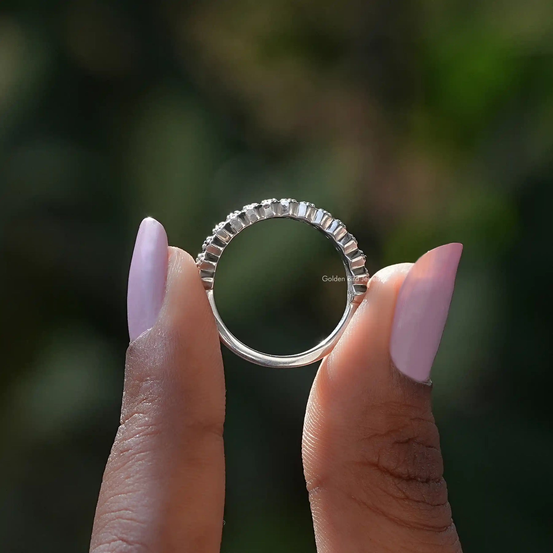 Back View of Black Gemstone Round Cut Moissanite Eternity Band In two fingers