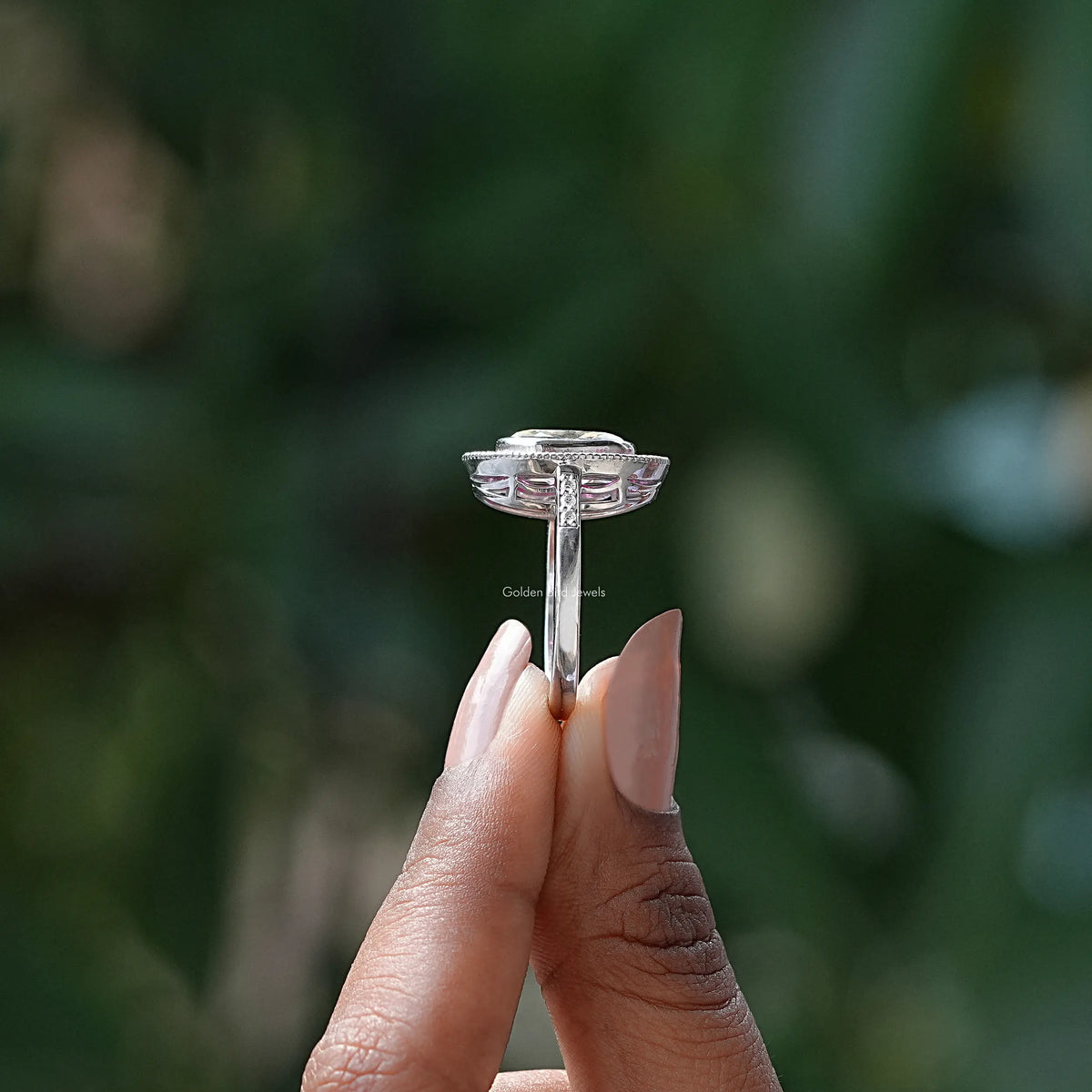 Side View of Crushed Ice Oval Moissanite Ring In two fingers