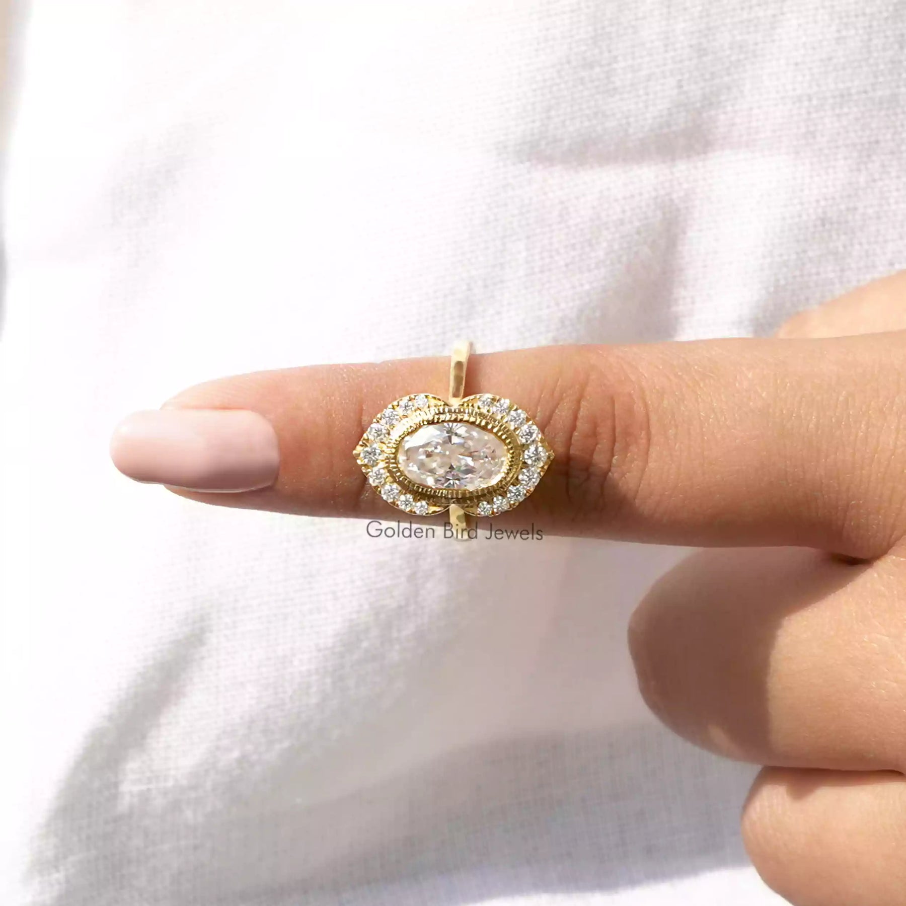 In finger front View of Oval and Round Cut Moissanite Engagement Ring
