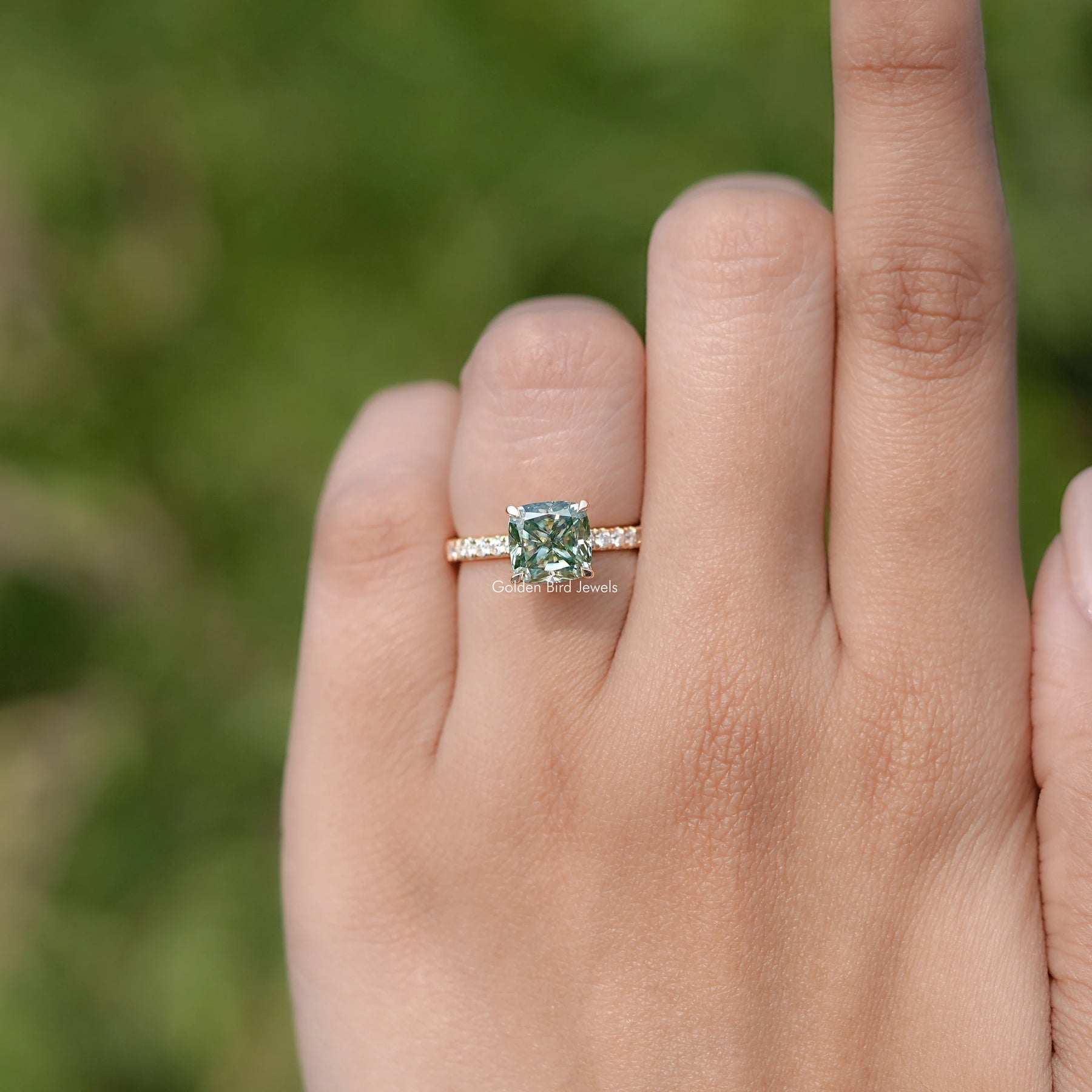 In finger front view of Cushion Cut Moissanite Engagement Ring