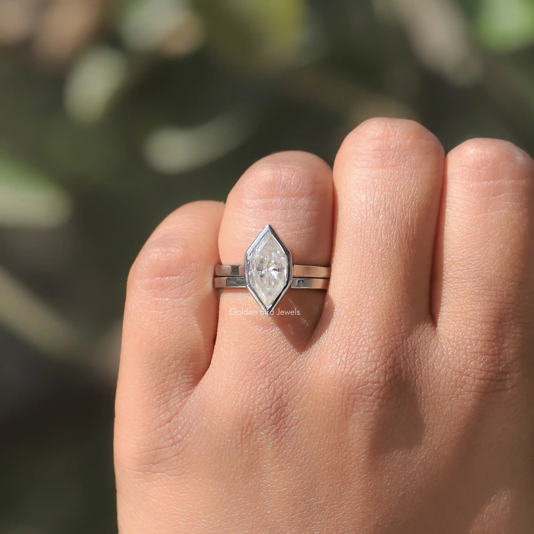 In finger front view of halo moissanite engagement ring for women's wear