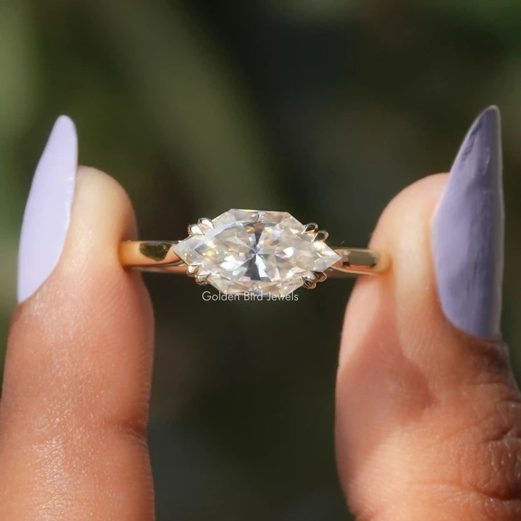 Front View of Dutch Marquise Solitaire Engagement Ring In two Fingers