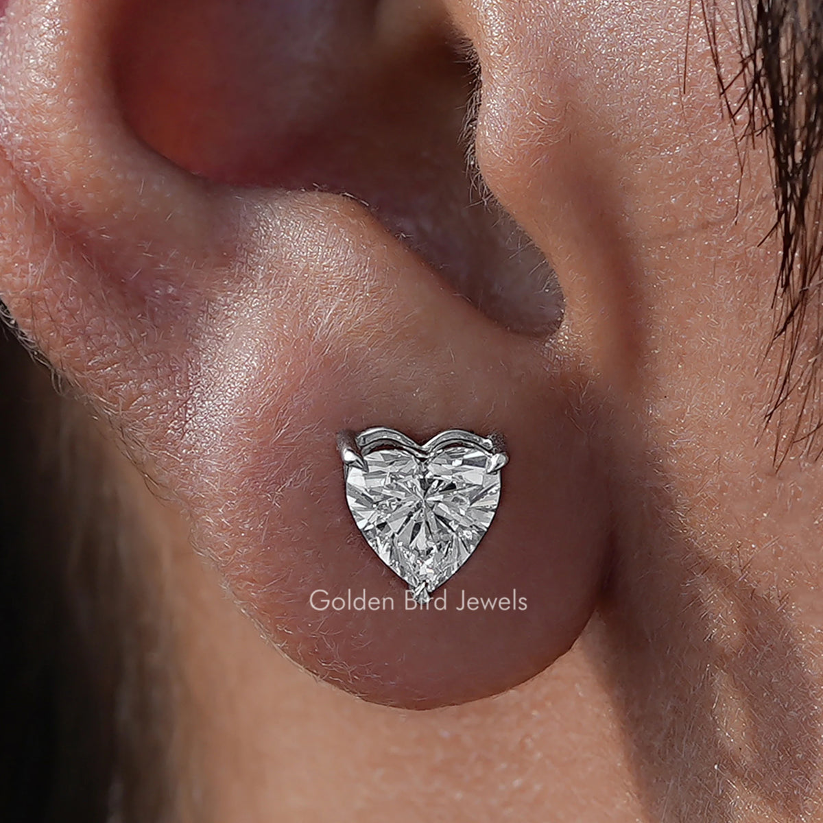 Close Up View Of Heart Cut Diamond Solitaire Stud Earrings