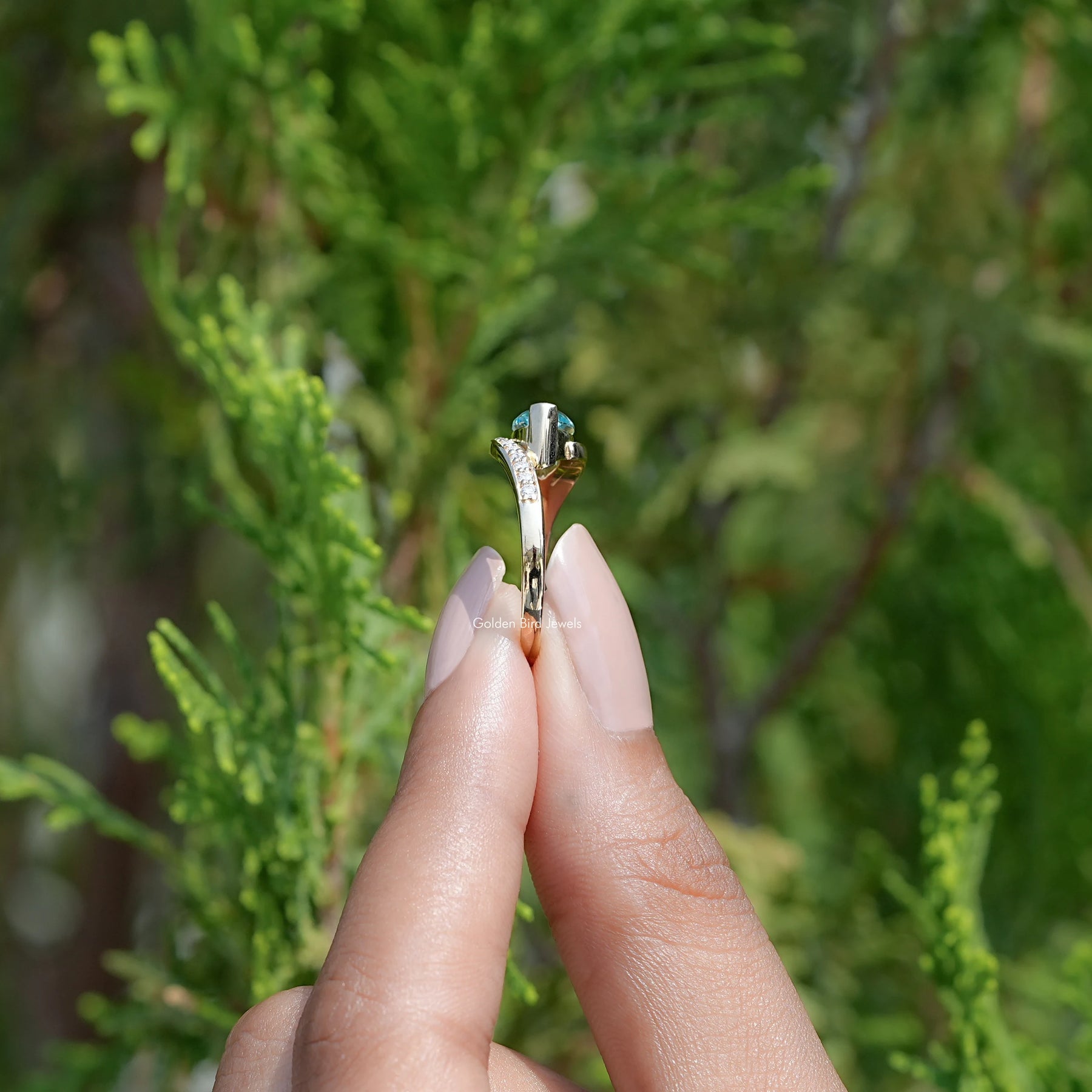 Side View of East West Blue Marquise Moissanite Bypass Ring