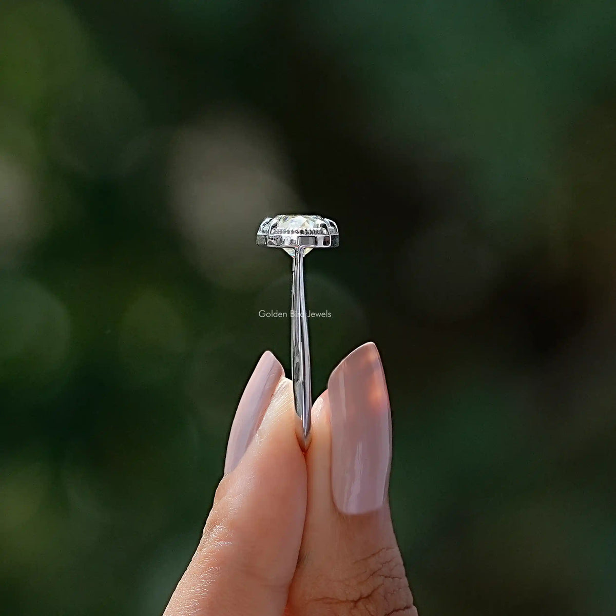 Side View of Moval Cut Moissanite East West Ring In two fingers