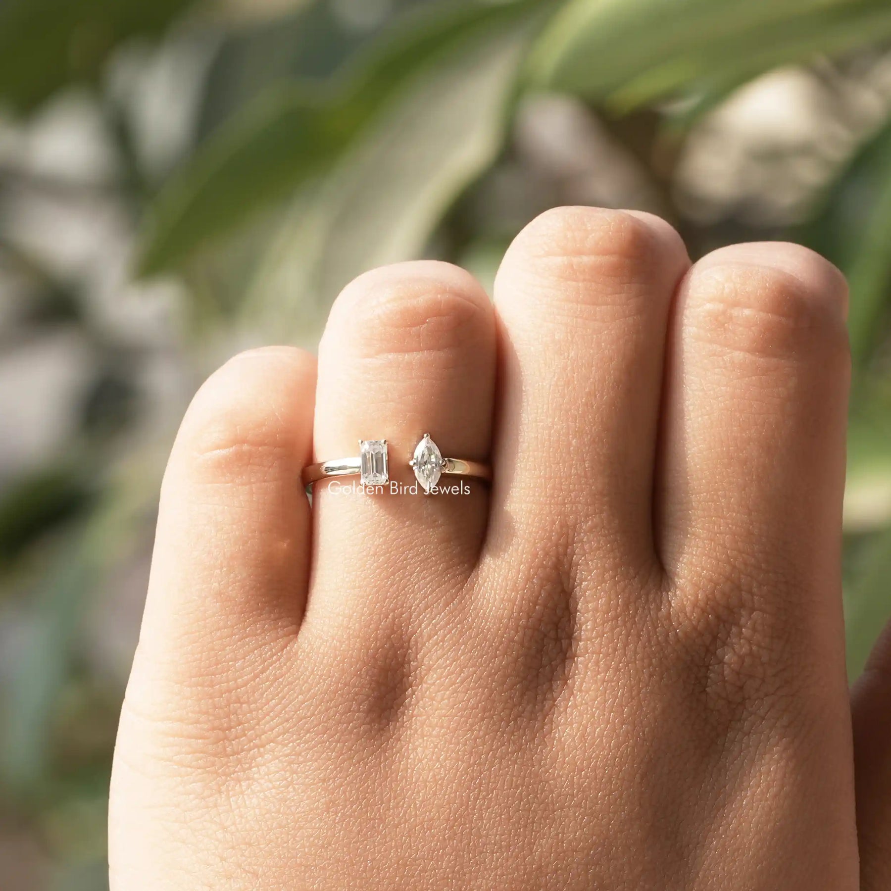 Colorless Marquise And Emerald Cut Open moissanite Ring in a secure setting