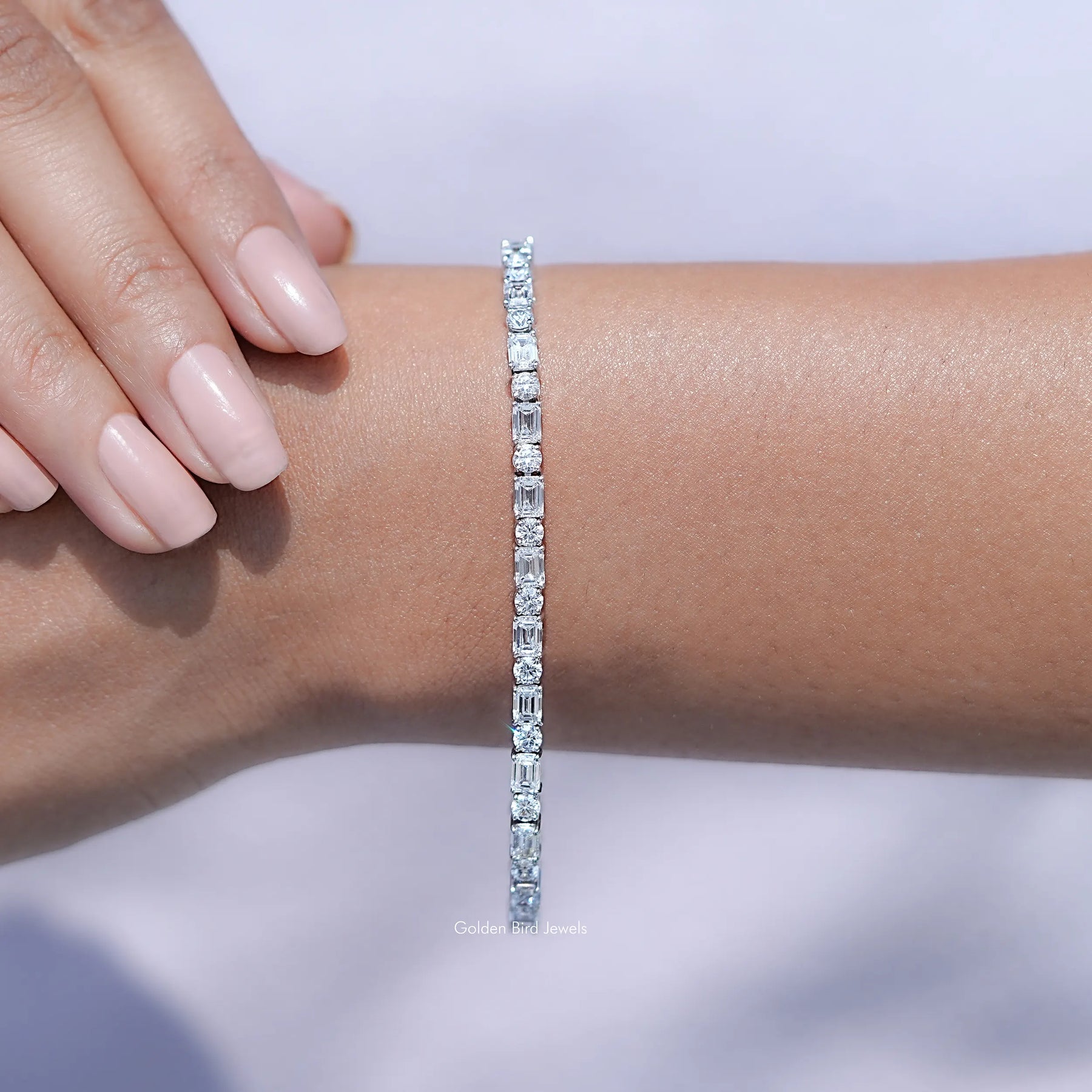 In hand Showing View Of Emerald Cut Lab Diamond Tennis Bracelet