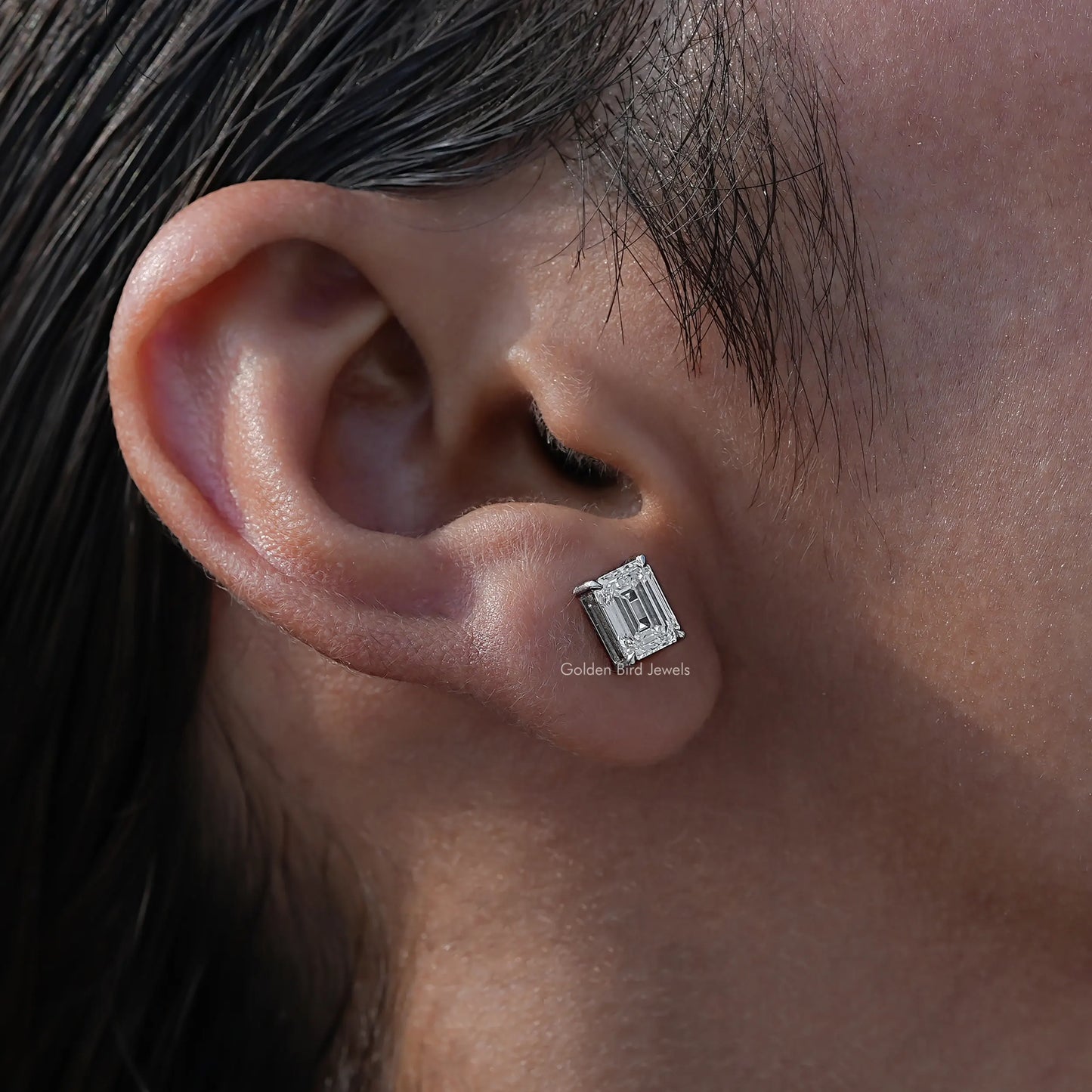 Detailed view of emerald cut diamond stud earings for women