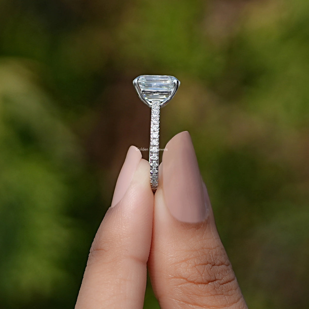 Side View of Emerald Cut Moissanite Bezel Set Engagement Ring