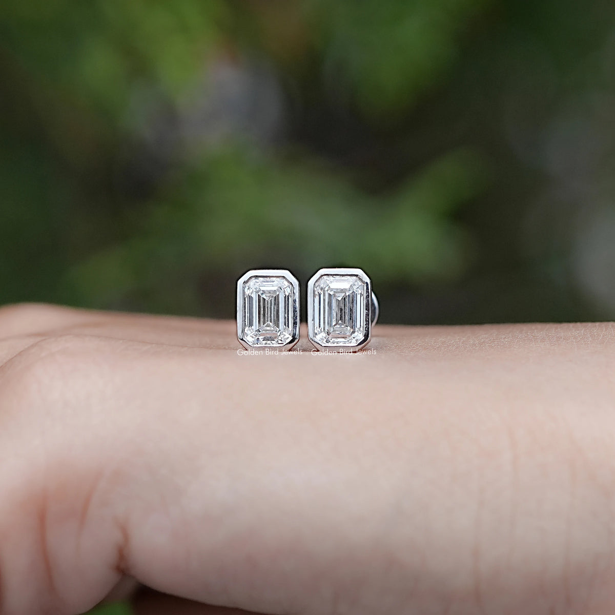 Front view of Emerald Cut Lab Diamond Bezel Set Stud Earrings