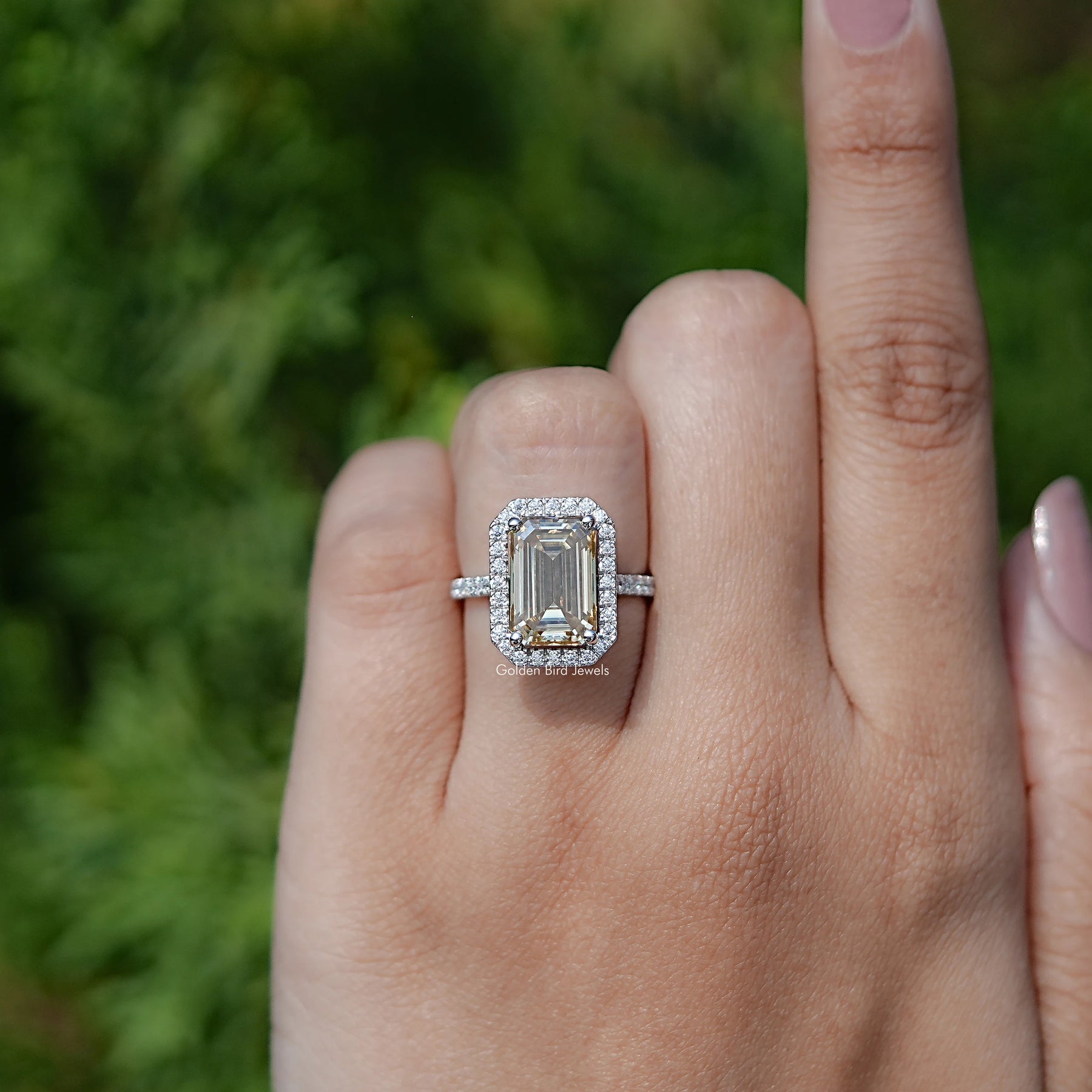 In finger front view of Emerald Cut Moissanite engagement ring