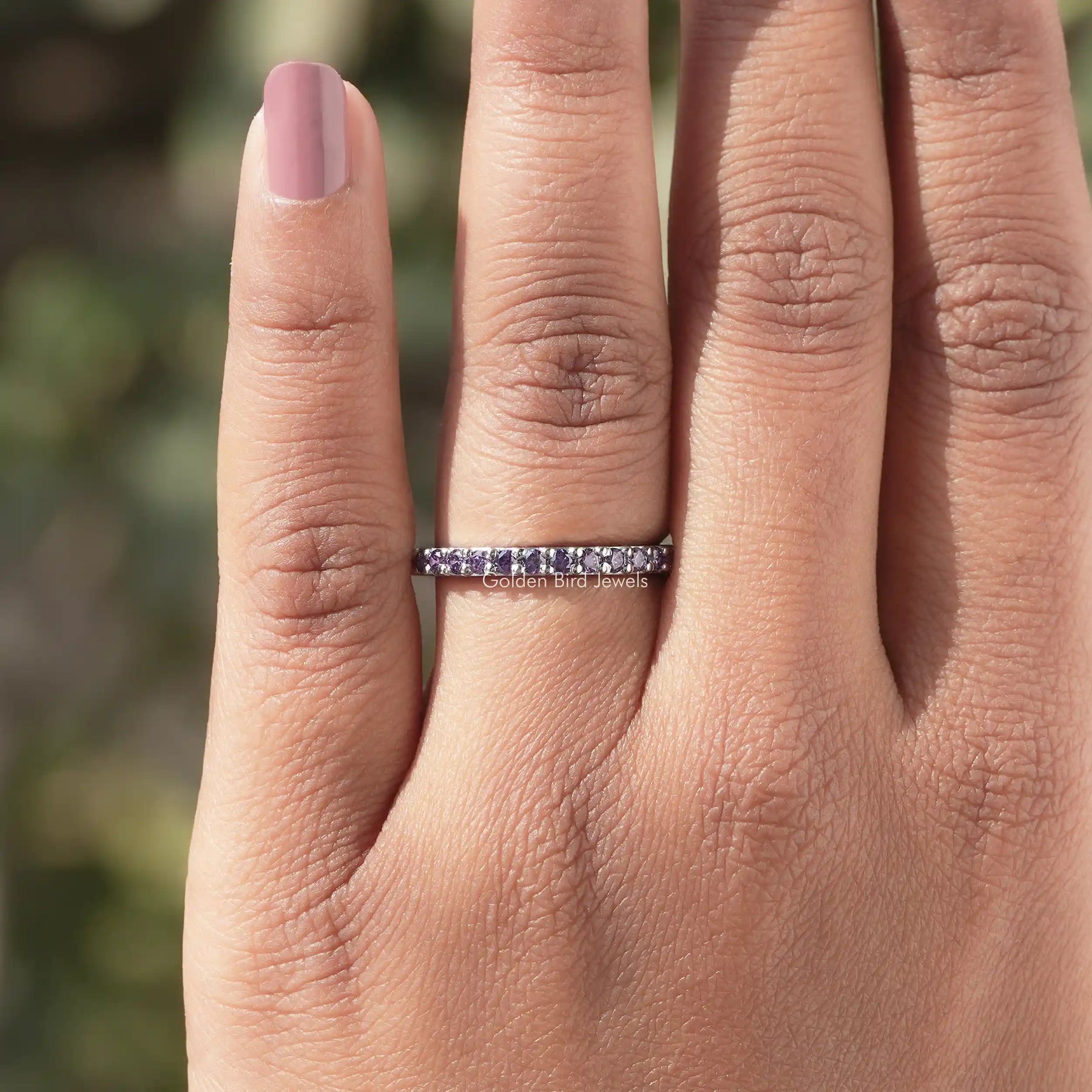 In finger view of Purple Amesthyst Round Gemstone Half Eternity Band