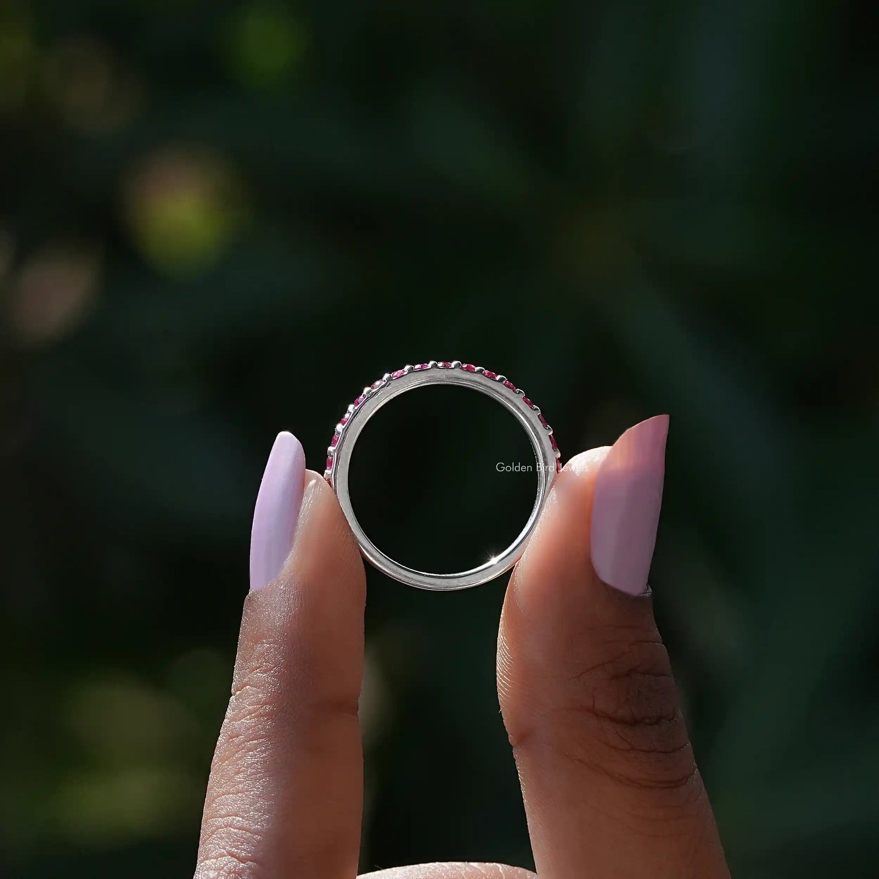 Back view of Pink Tourmaline Round Eternity Band in secure setting