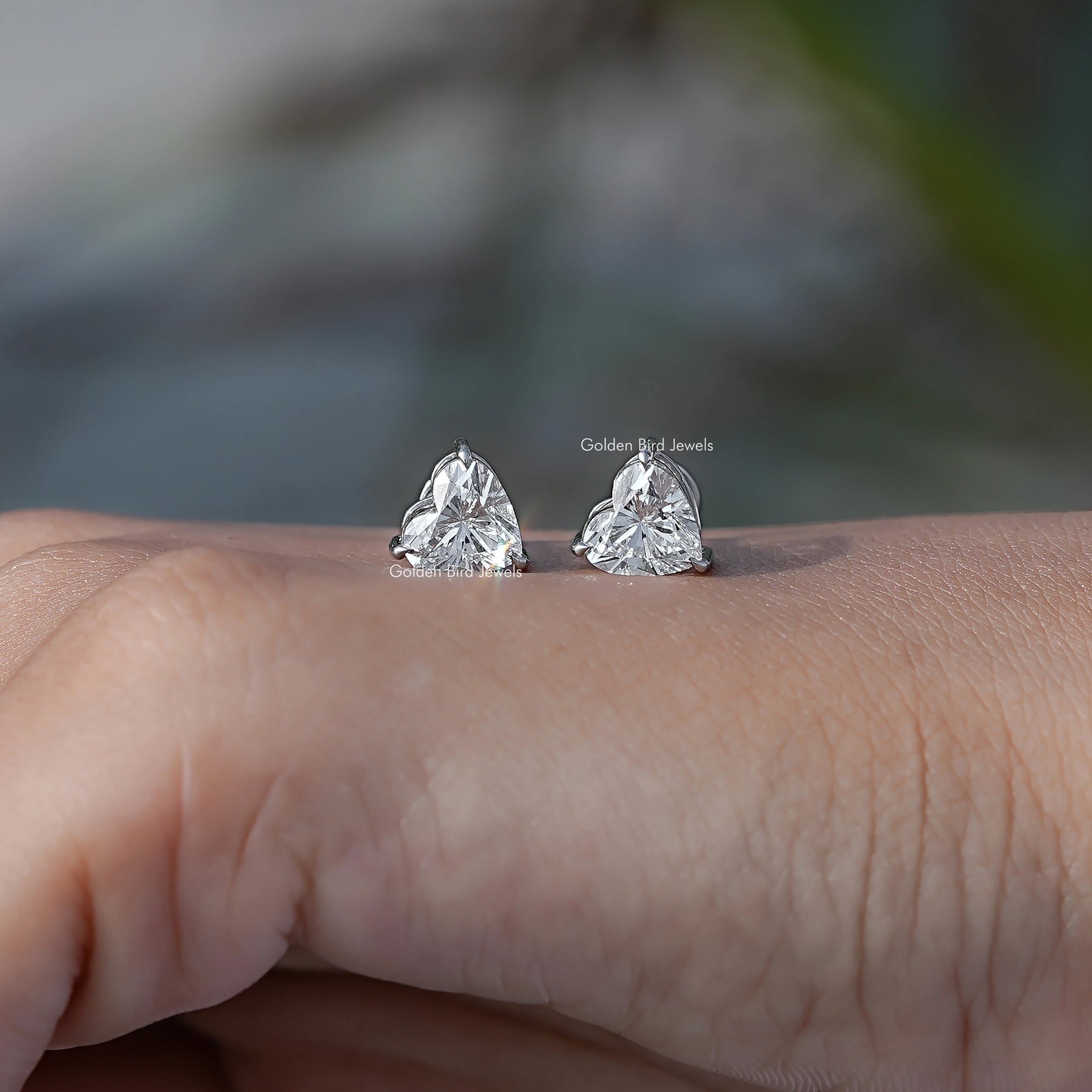 In Hand View Of heart shaped diamond Stud Earring