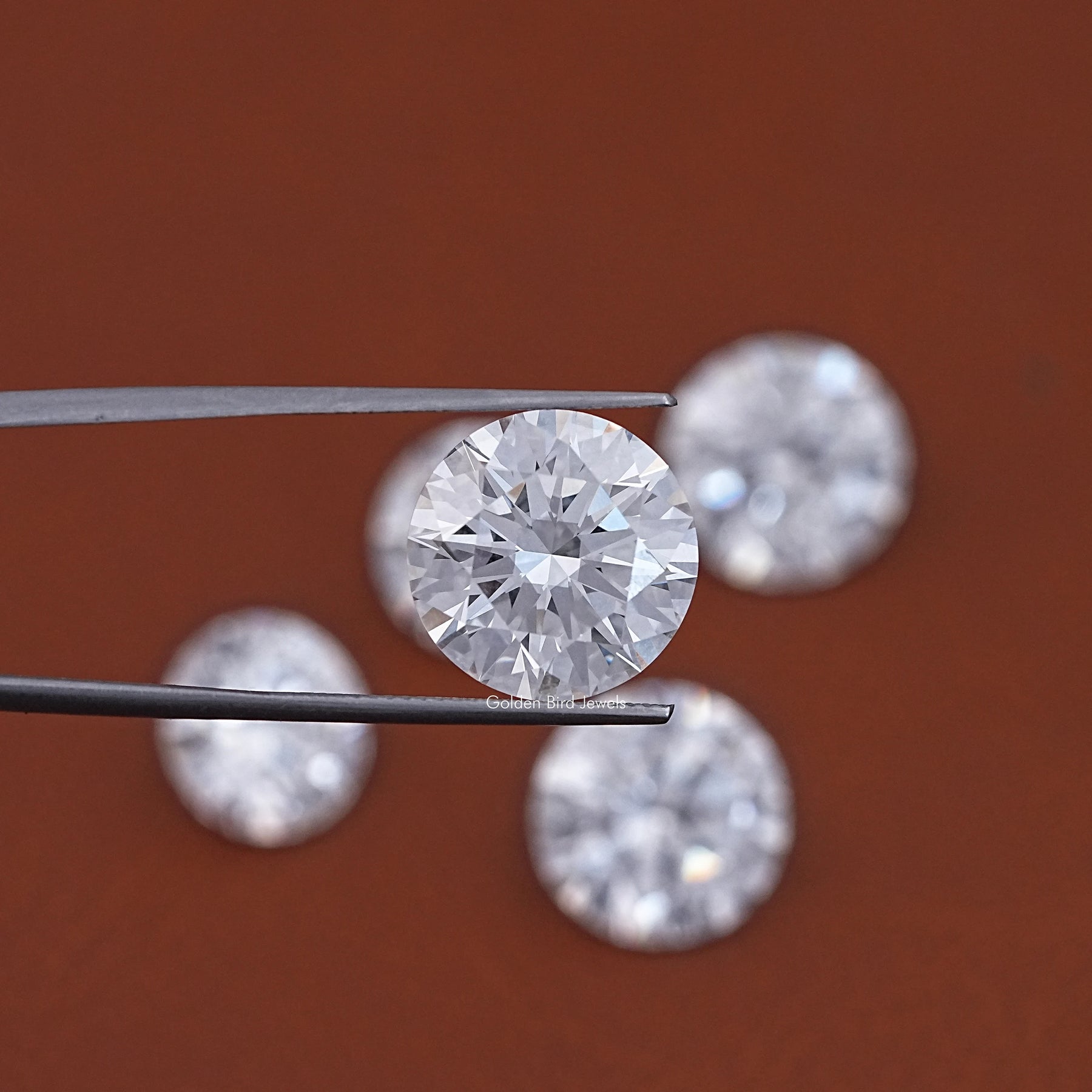 In Tweezer View Of Round Cut Lab Loose Diamond