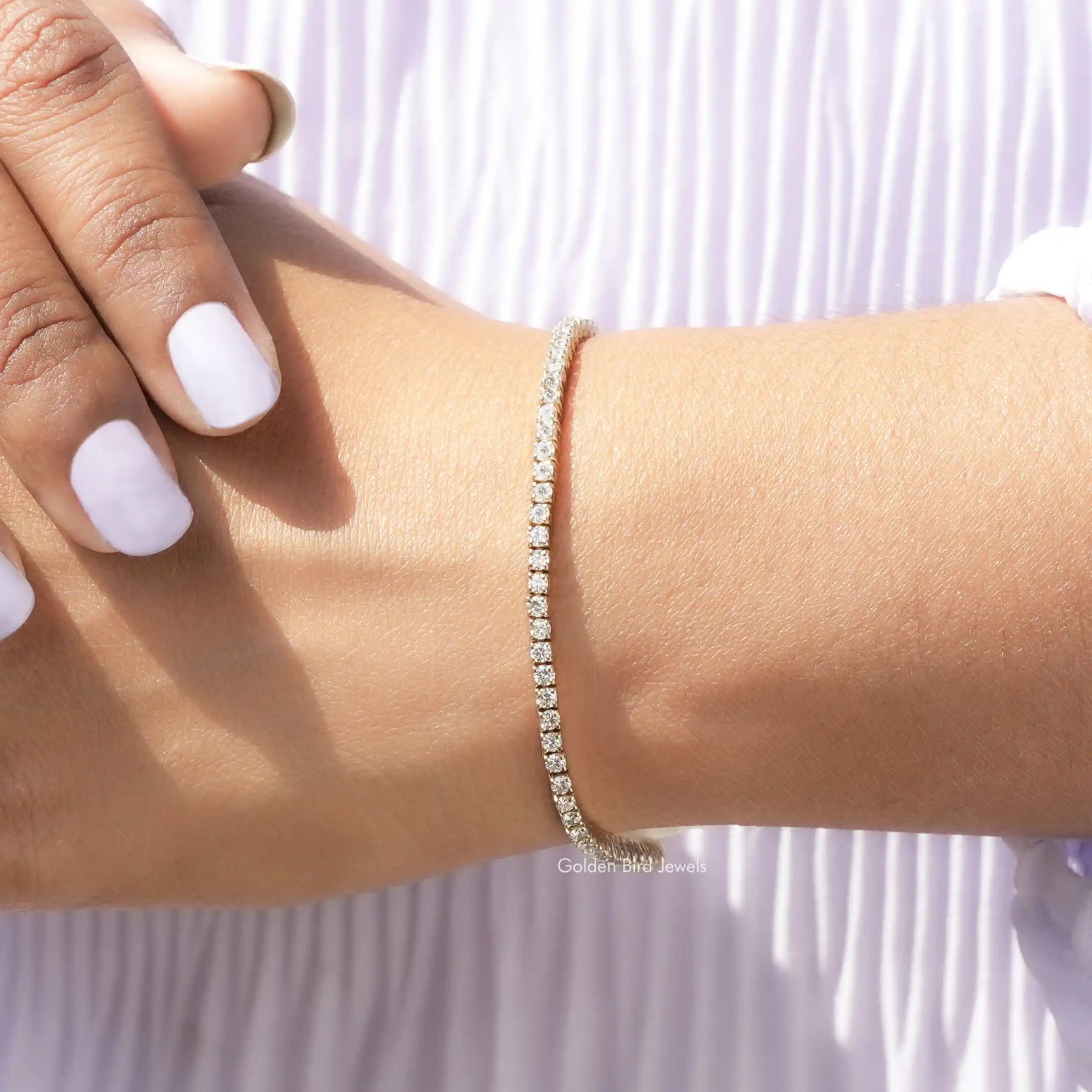 In Hand Showing View Of LGD Round Cut Tennis Bracelet
