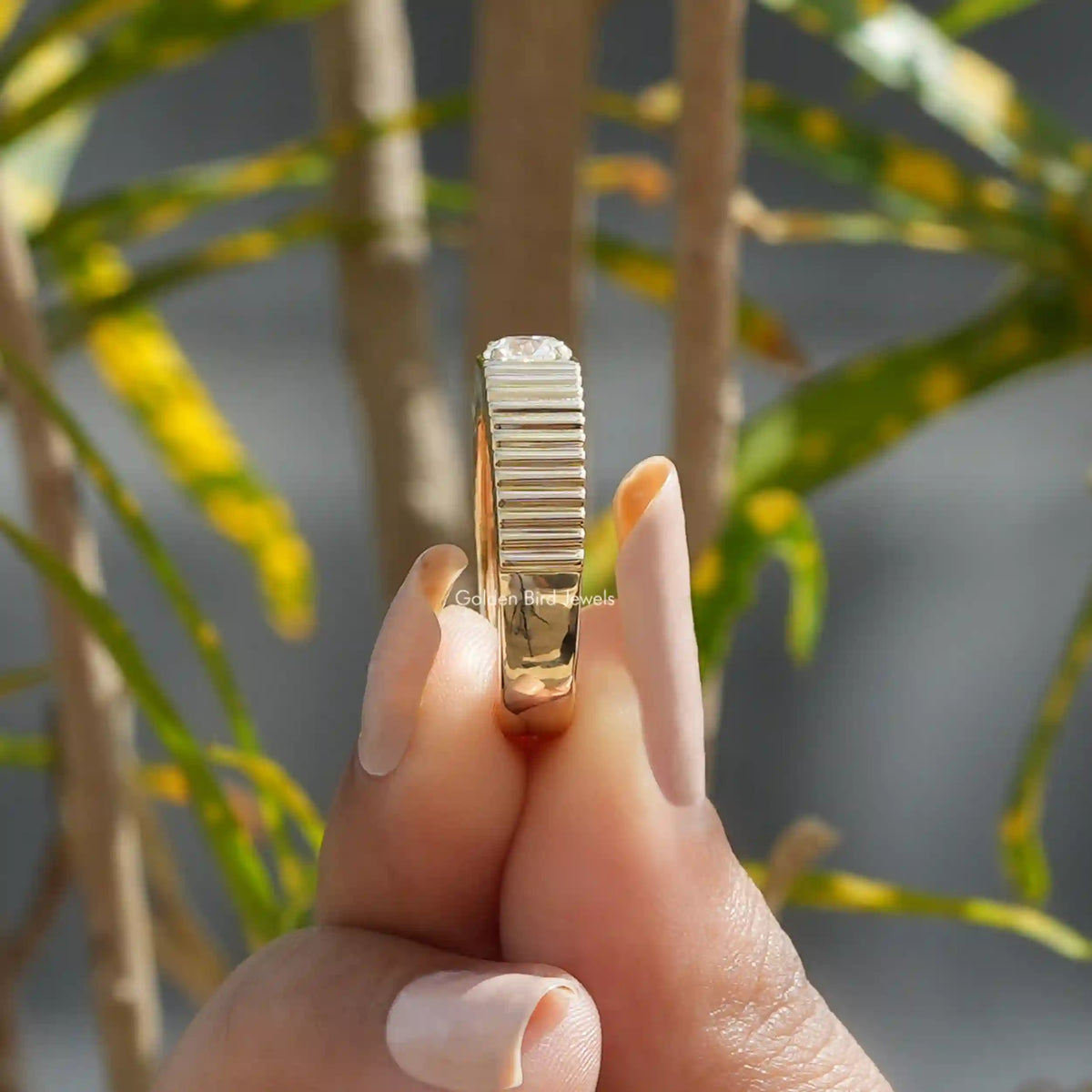 Side View of Round Cut Lab-Grown Solitaire Engagement Ring  IN Two Fingers