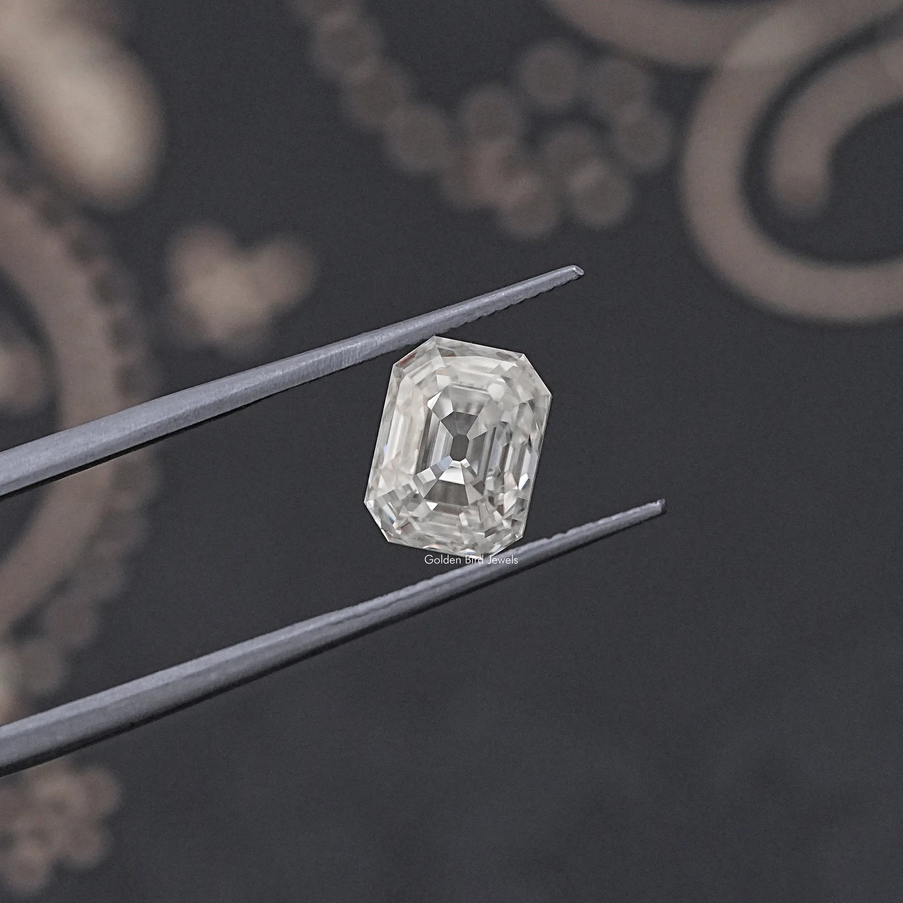 tweezers View of Timeless Old Mine Cut Emerald Moissanite Loose Gemstone with colorless clarity