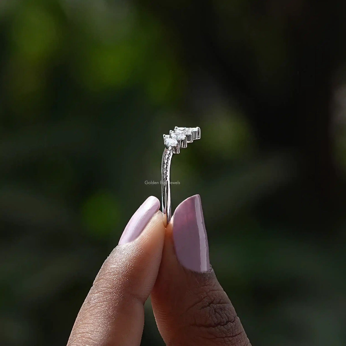 Side View of Marquise Cut Curved Diamond Wedding Band In two fingers