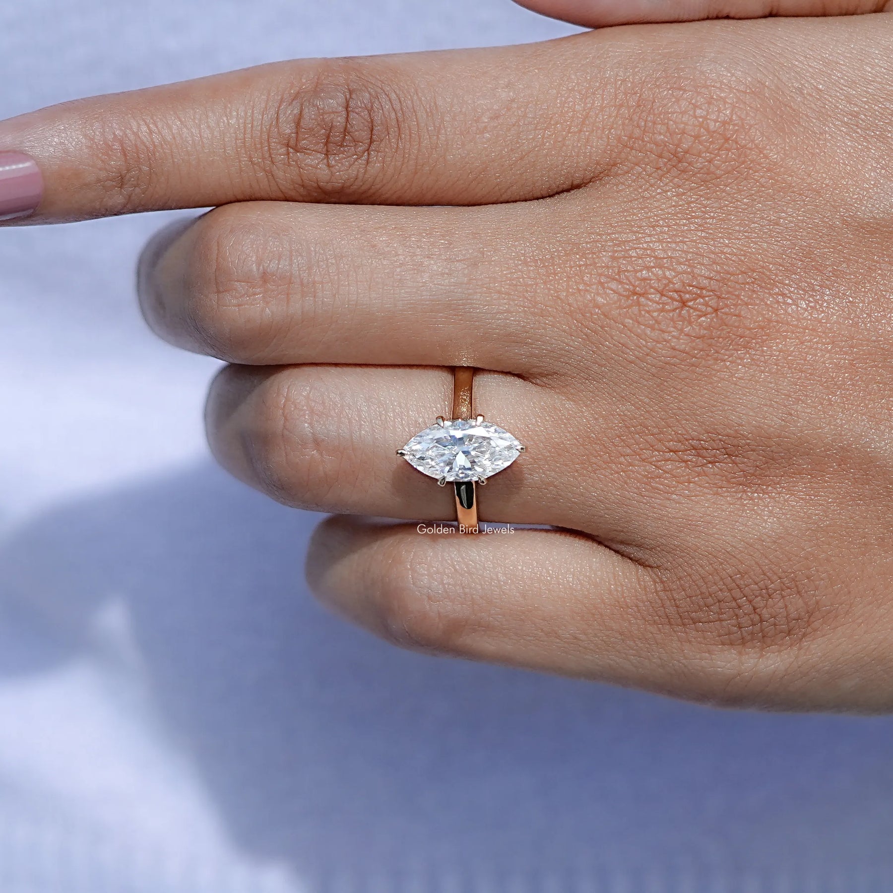 In finger front view of Dutch Marquise Cut Ring in unique shape