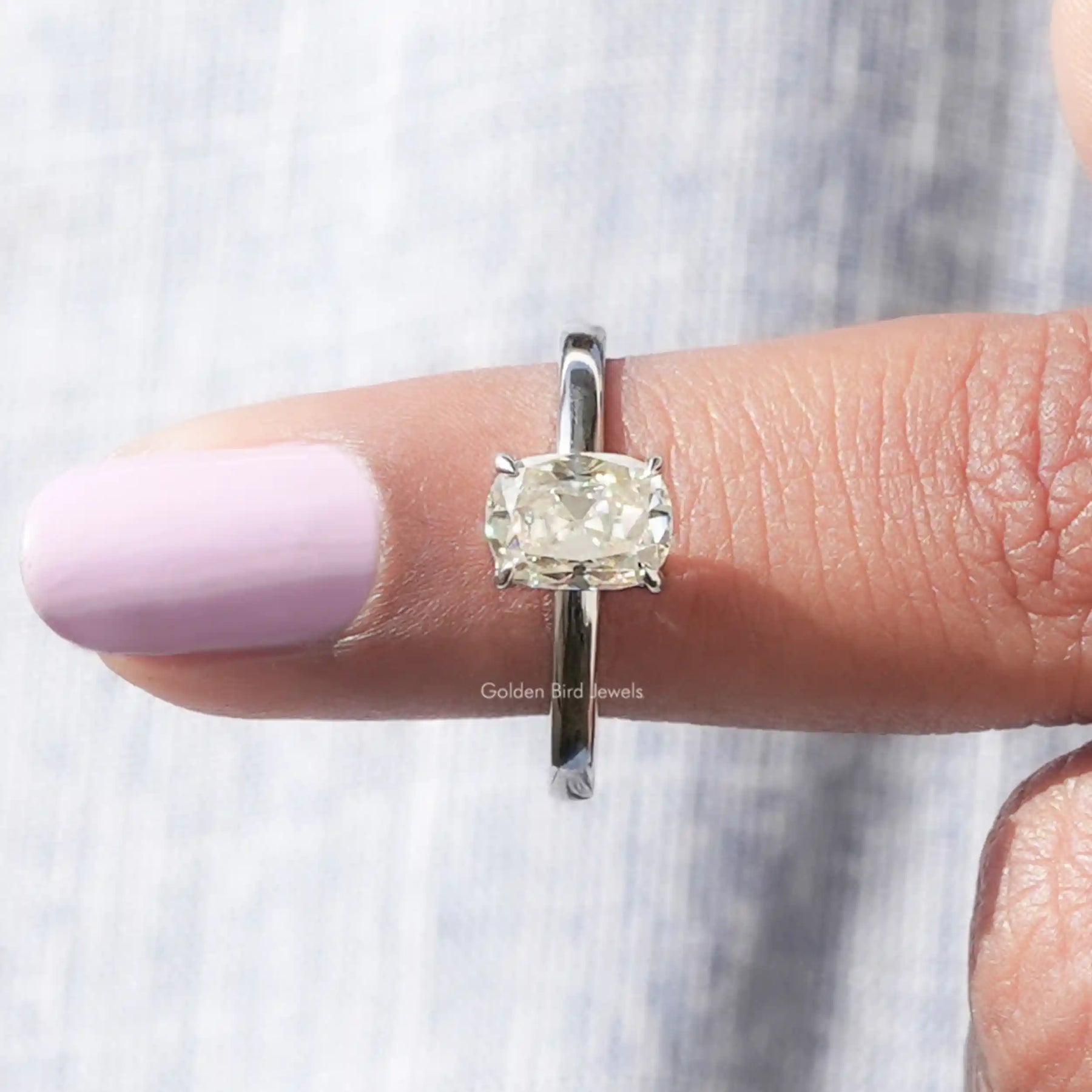 In finger front View of Cushion Cut Moissanite Ring