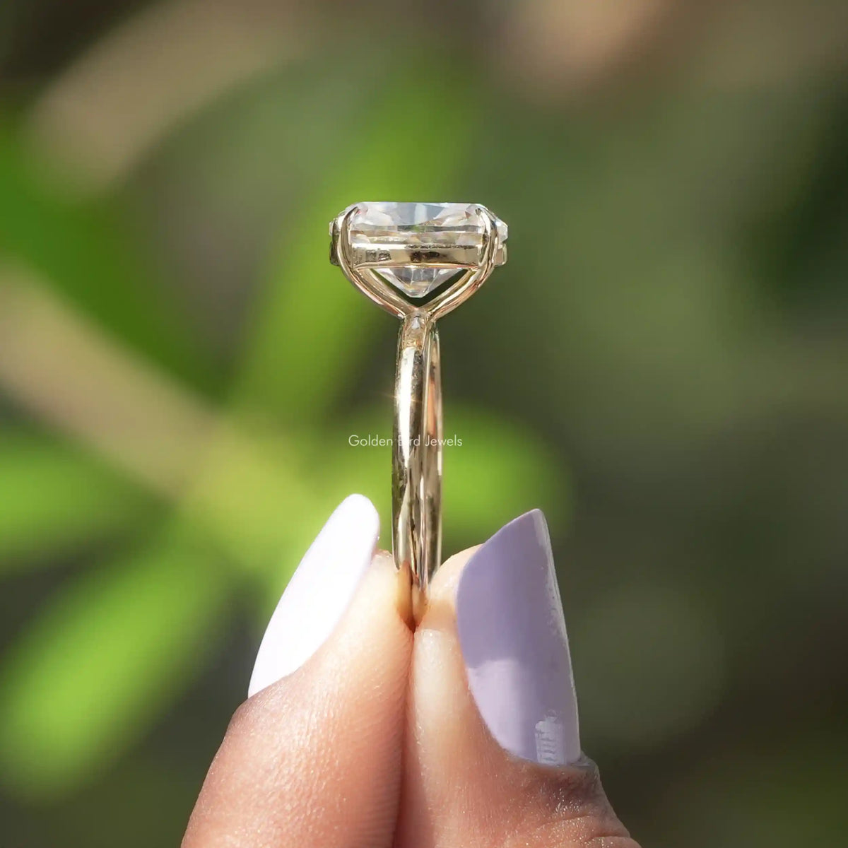 Side View of Old Mine Cushion Cut Ring In two fingers