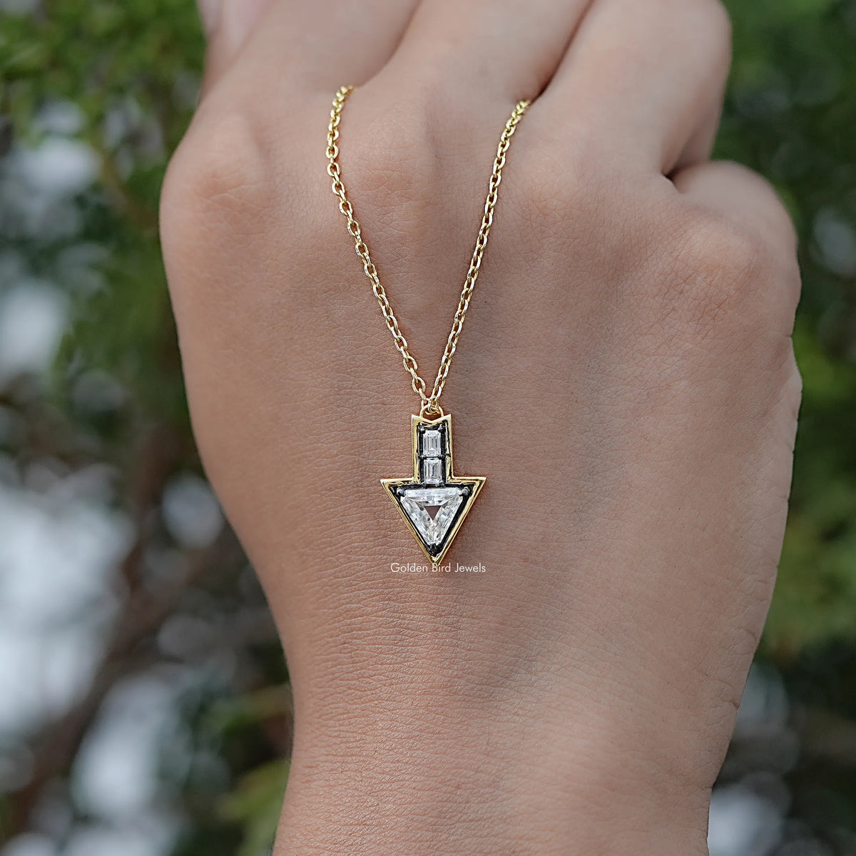 Close View Of Triangle And Baguette Moissanite Arrow Shape Pendant in Secure Setting
