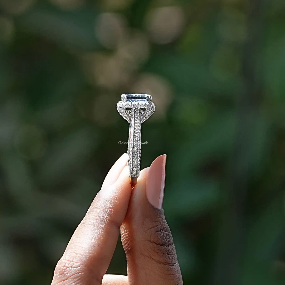 Side View of Criss Cut Moissanite Accent Stone Ring In two fingers