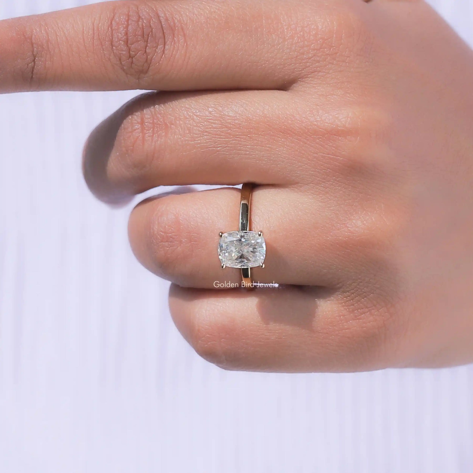 View of Cushion Cut Moissanite Engagement Ring In Yellow Gold