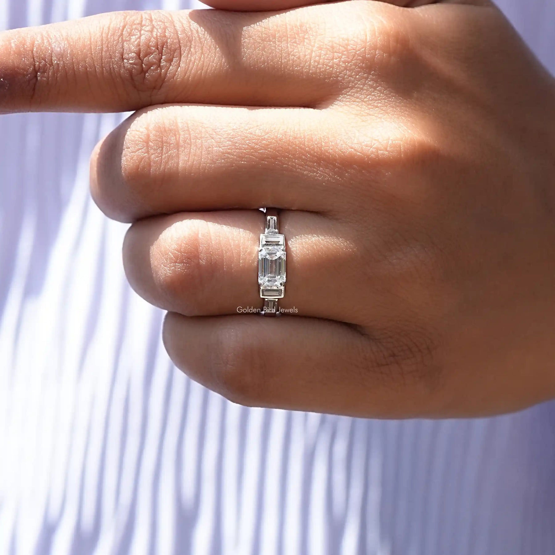 Colorless Emerald Cut Moissanite Ring In finger