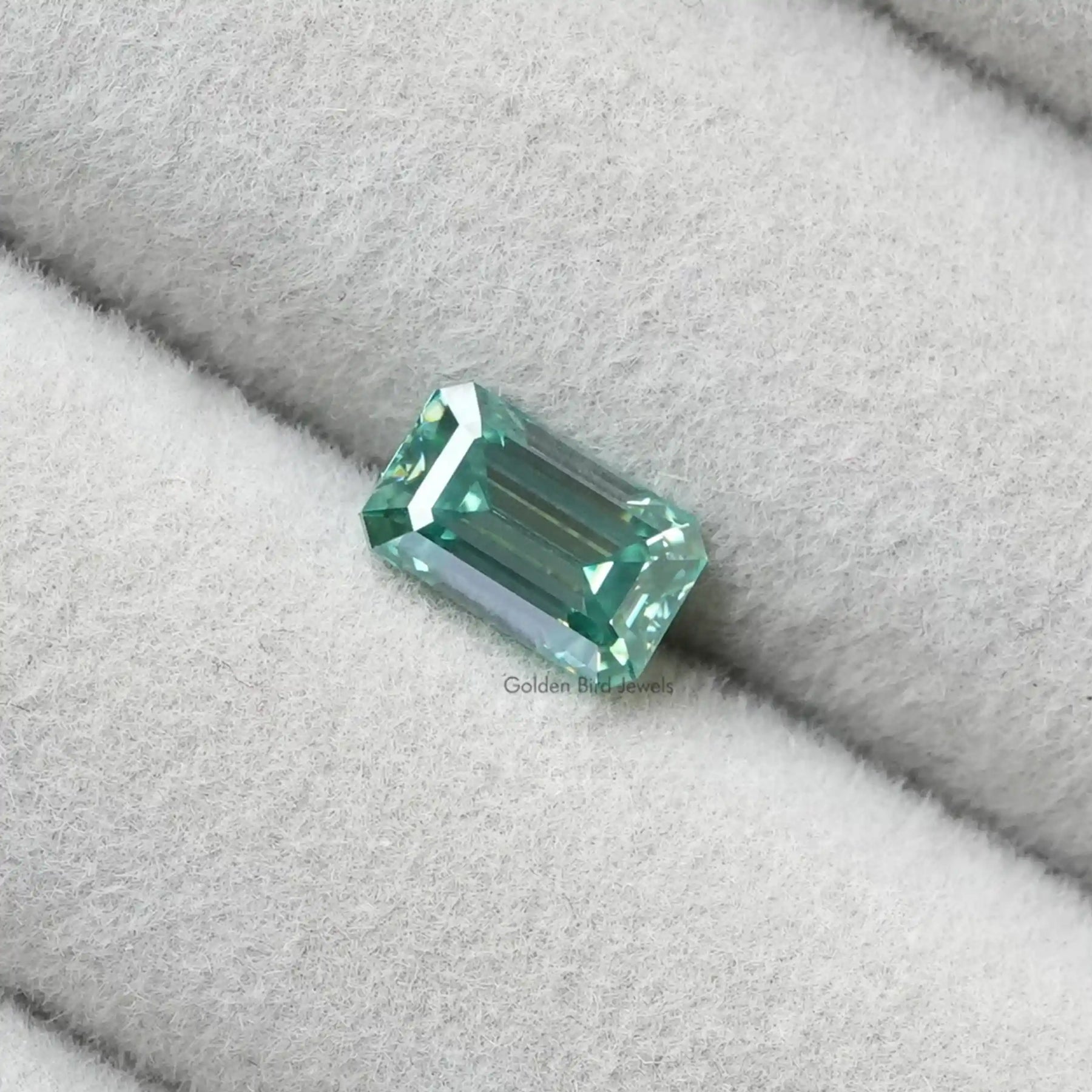 Close View Of Dark Green Emerald Shaped Loose Stone