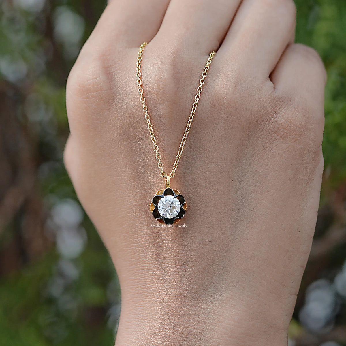 Close View Of Old European Cut Round Moissanite Flower Style Pendant in Secure Setting