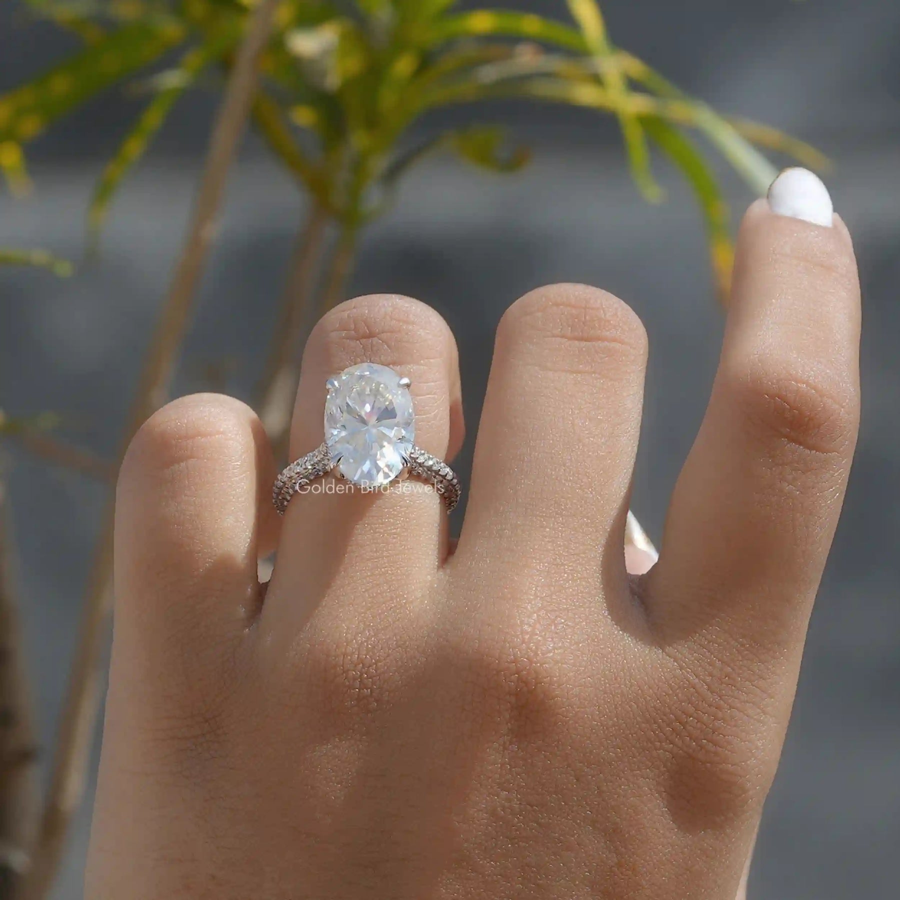 View of Moissanite Hidden Halo Oval Cut Engagement Ring In White Gold