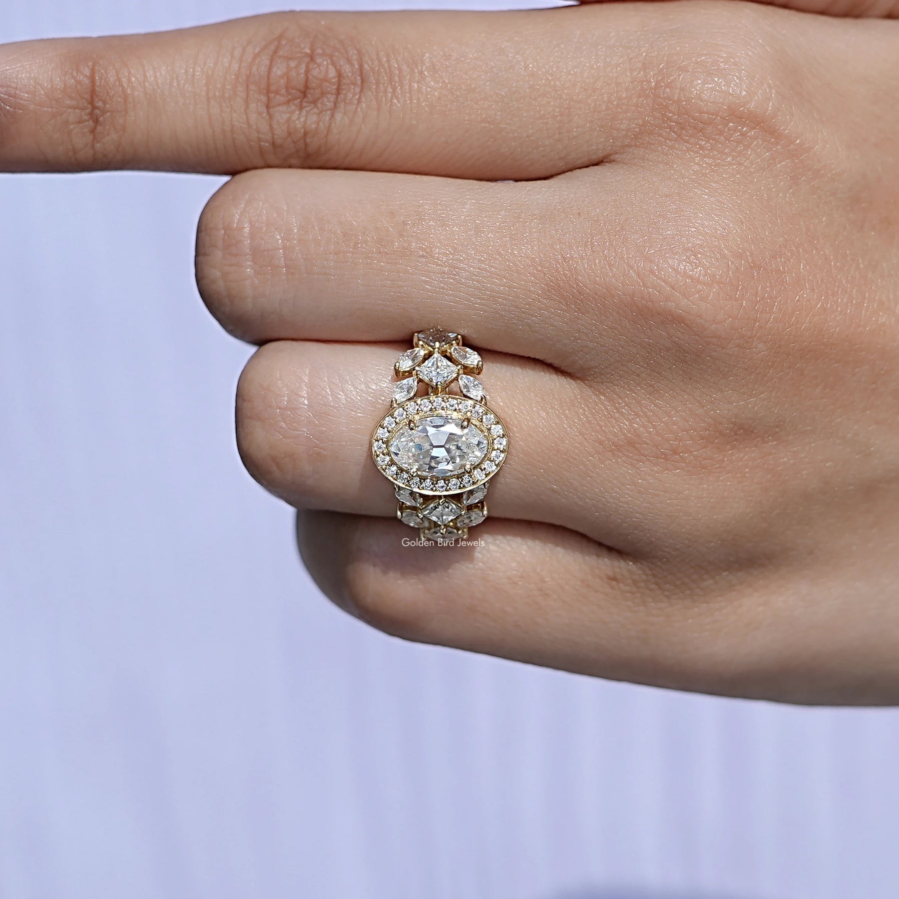 Close-Up View of Old Mine Moval Cut Halo Cluster Ring In Yellow Gold