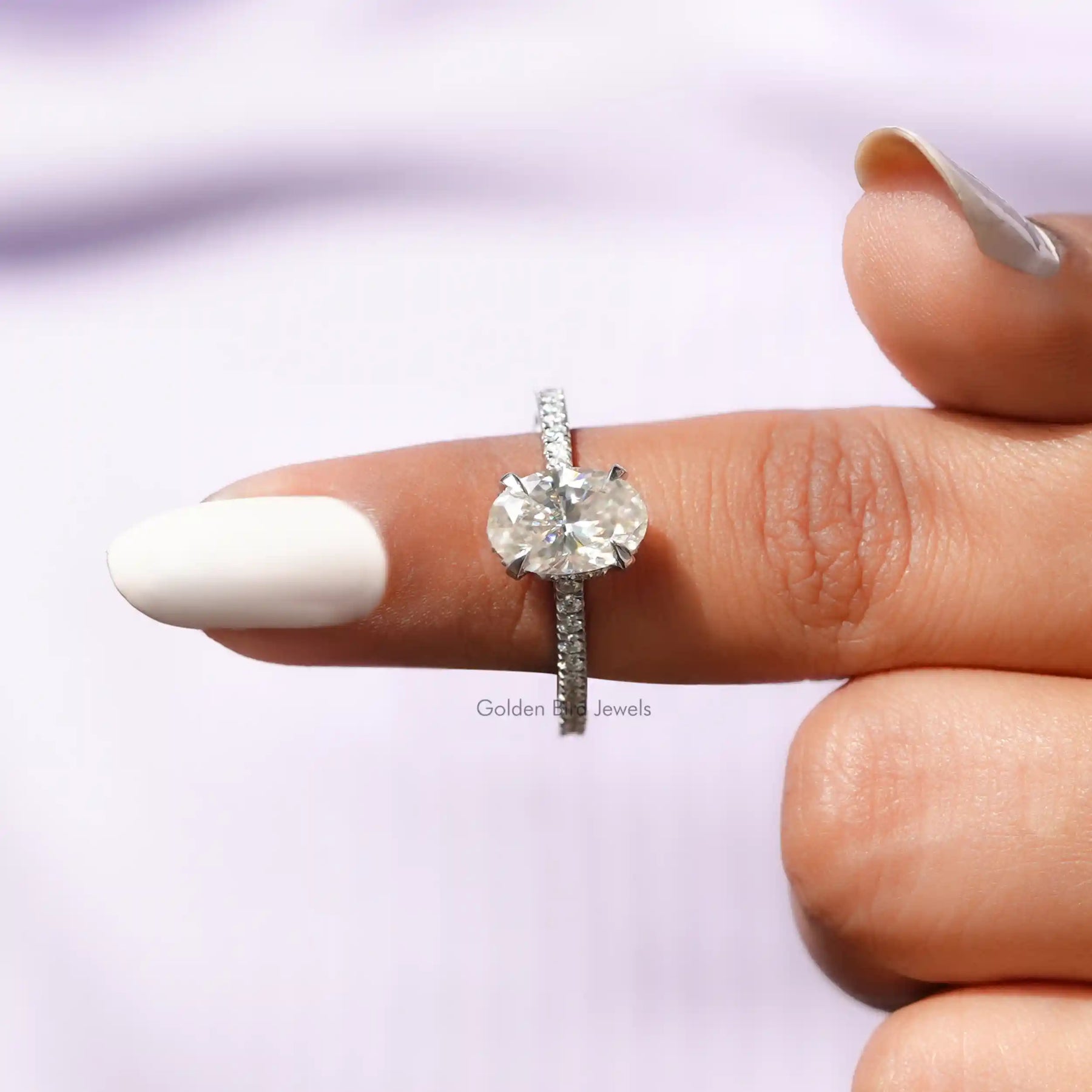 In finger front View of Oval Cut Moissanite Engagement Ring