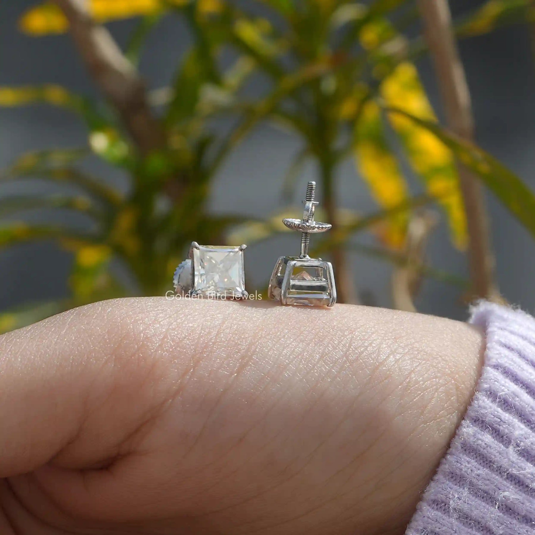 Front And Back Side View Of solitaire stud earrings crafted in moissanite