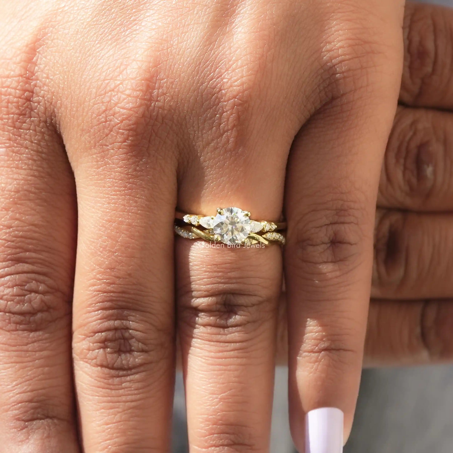 In finger front view of Lab Diamond Round Cut Ring in unique shape