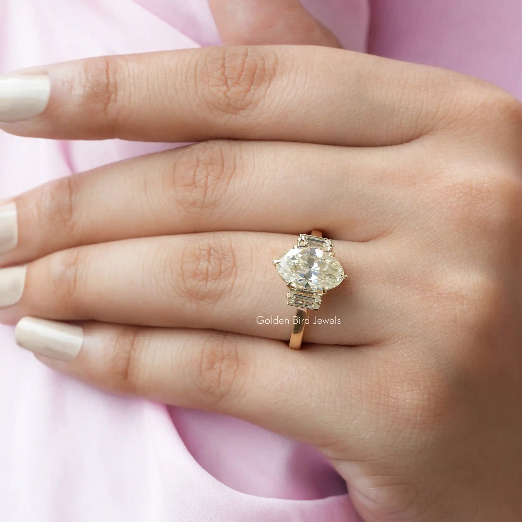 Close view of moissanite baguette and moval cut ring