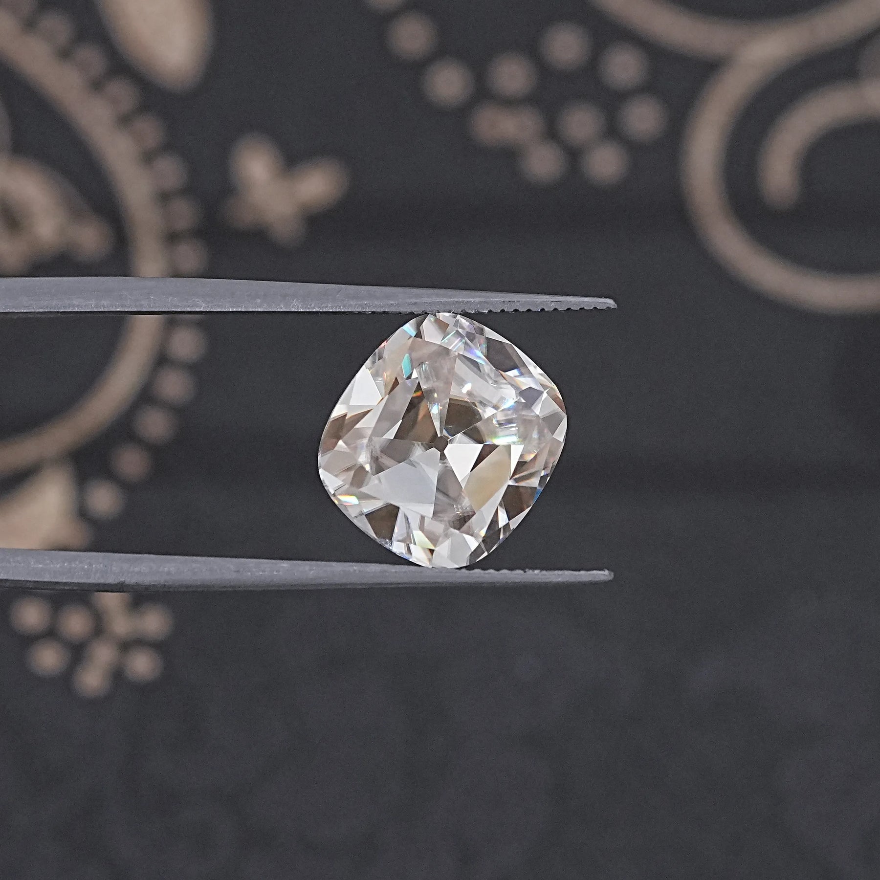 In Tweezer View Of Old Mine Cushion Cut Loose Moissanite Stone